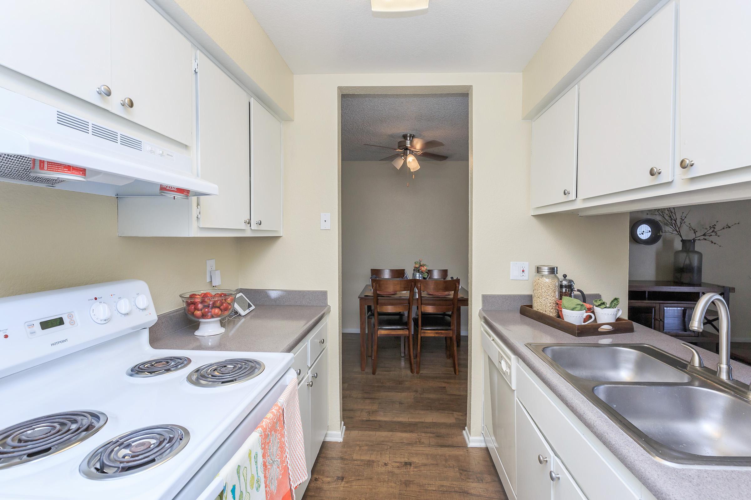 Furnished kitchen with white appliances