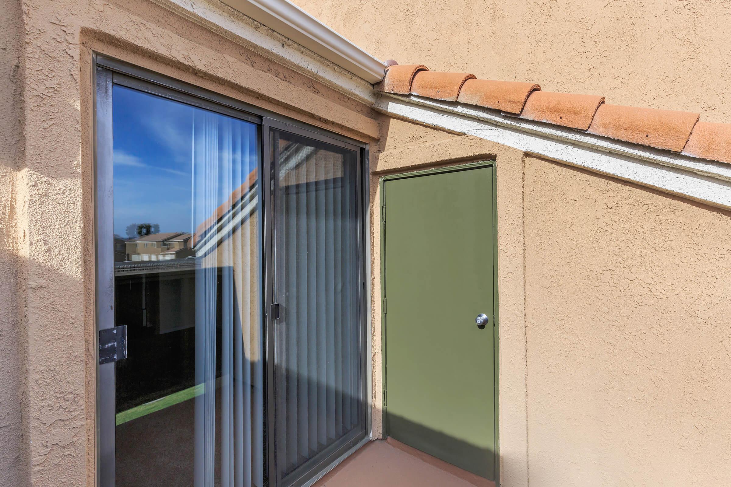 Balcony with a green door