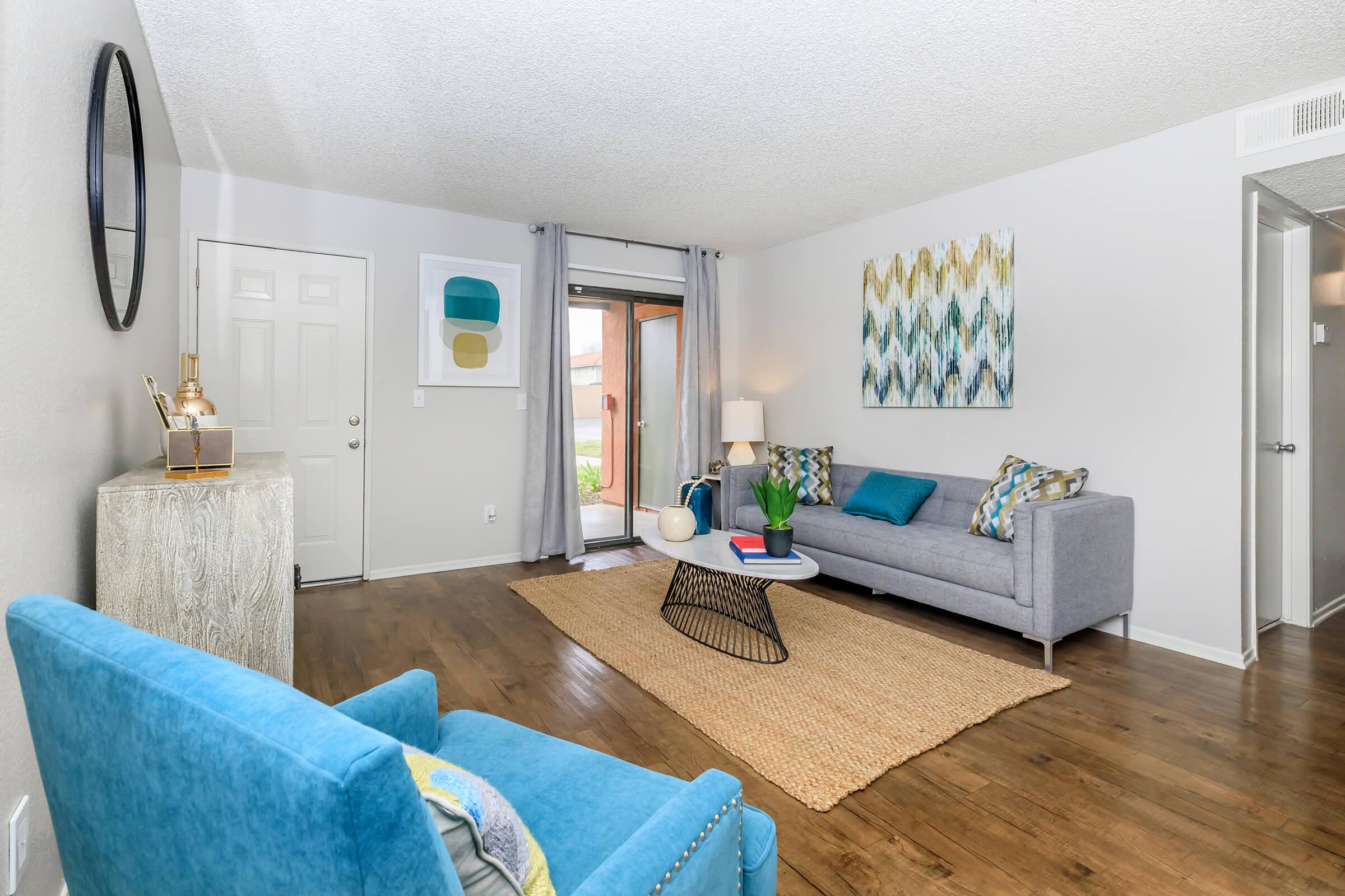 Living room with grey and blue couches