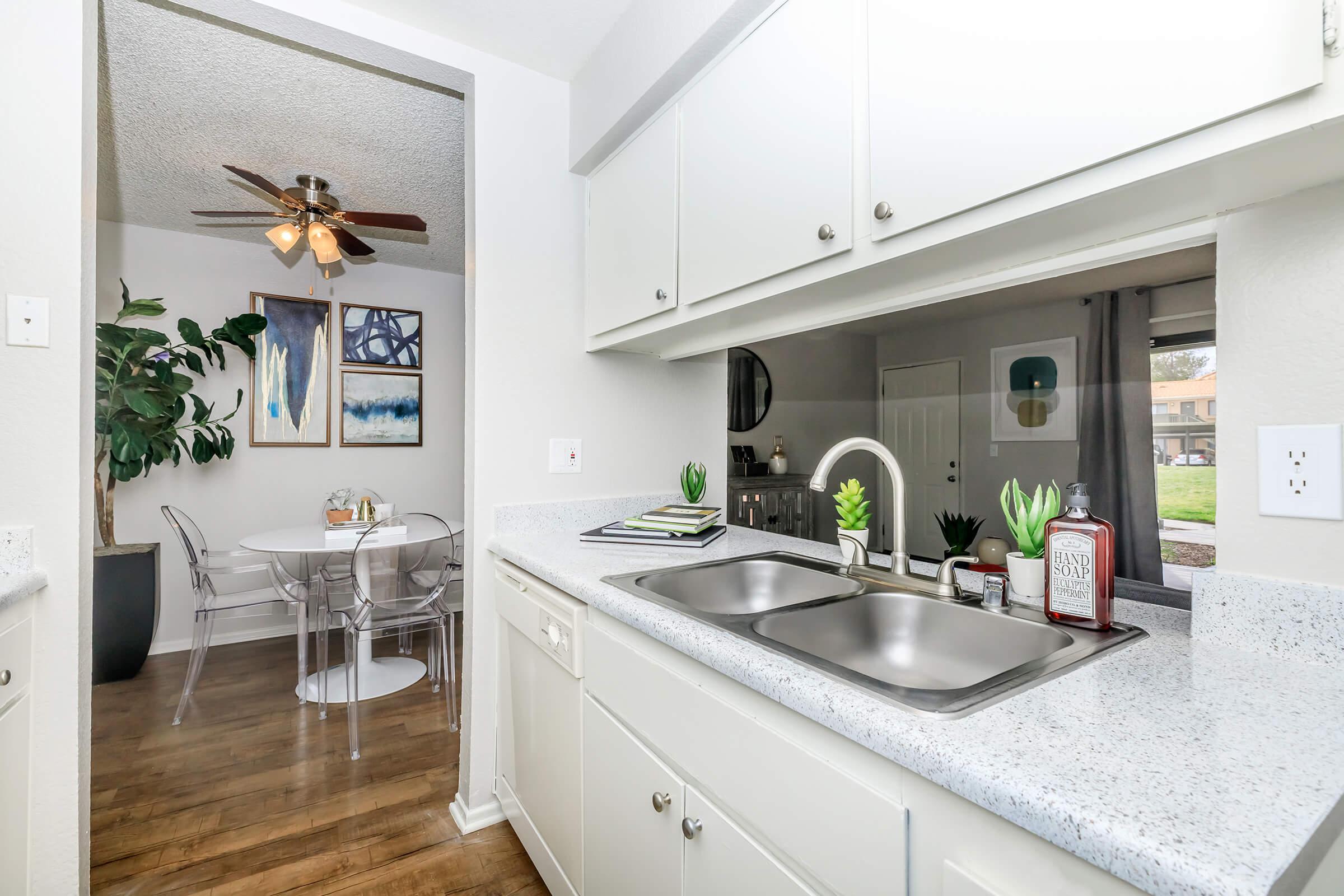 Furnished kitchen and dining room with wooden floors