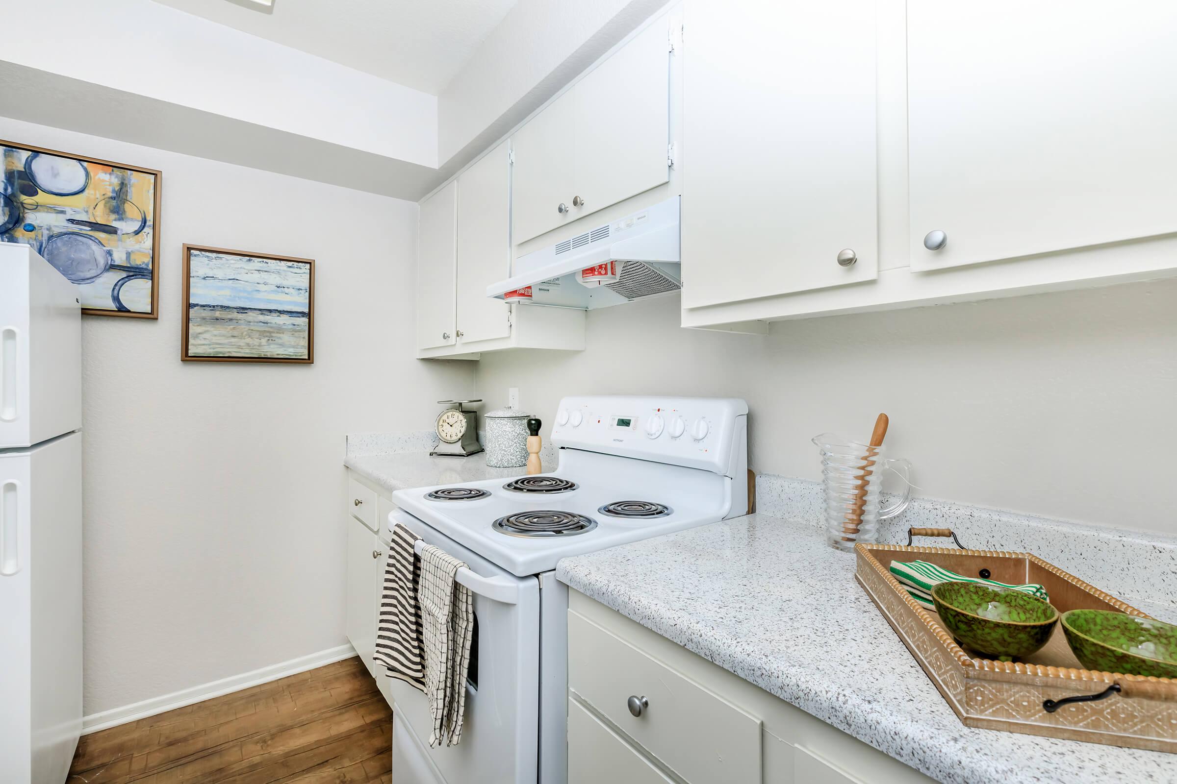 Furnished kitchen with grey countertops