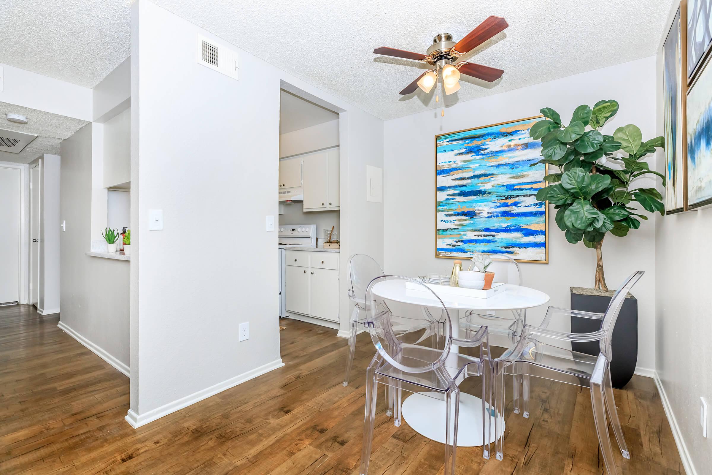 Dining room with a white table and clear chairs