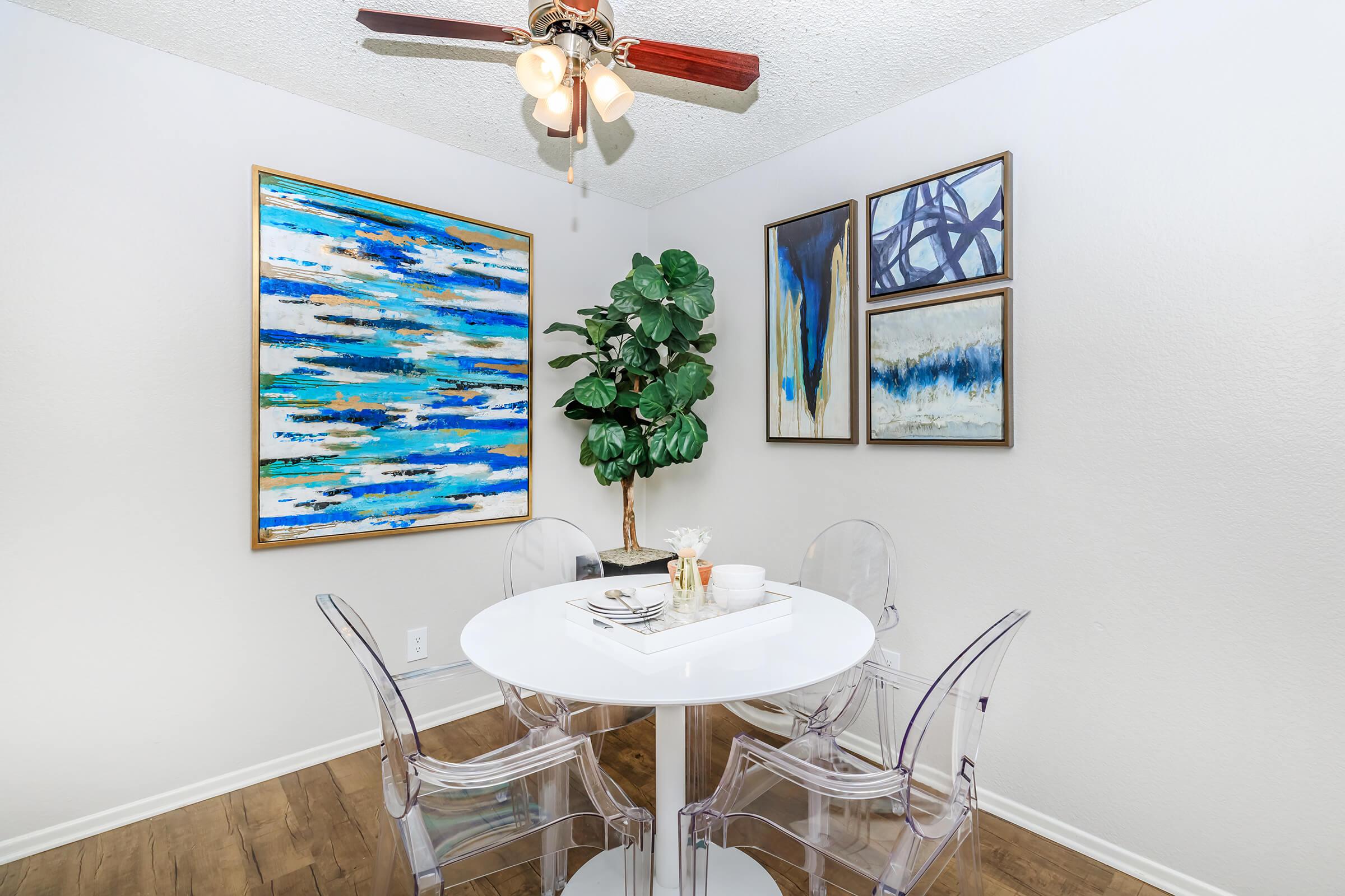 Furnished dining room with artwork