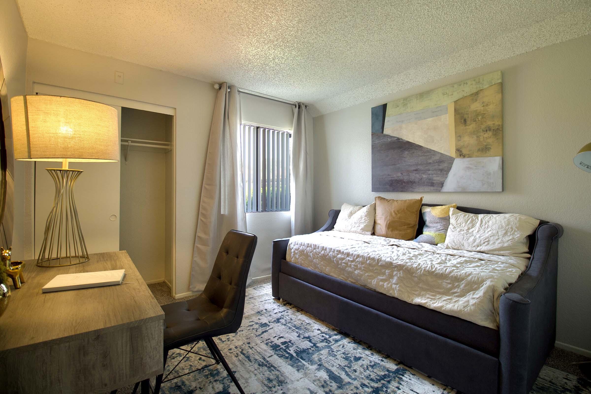 a bedroom with a large bed in a hotel room