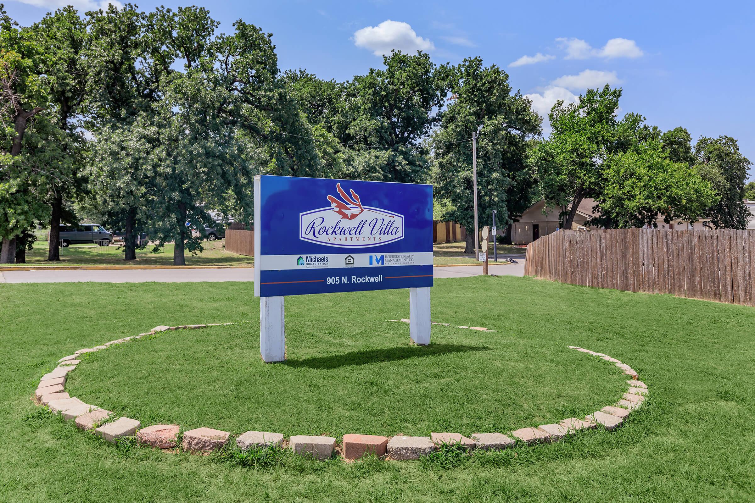 a large lawn in front of a sign