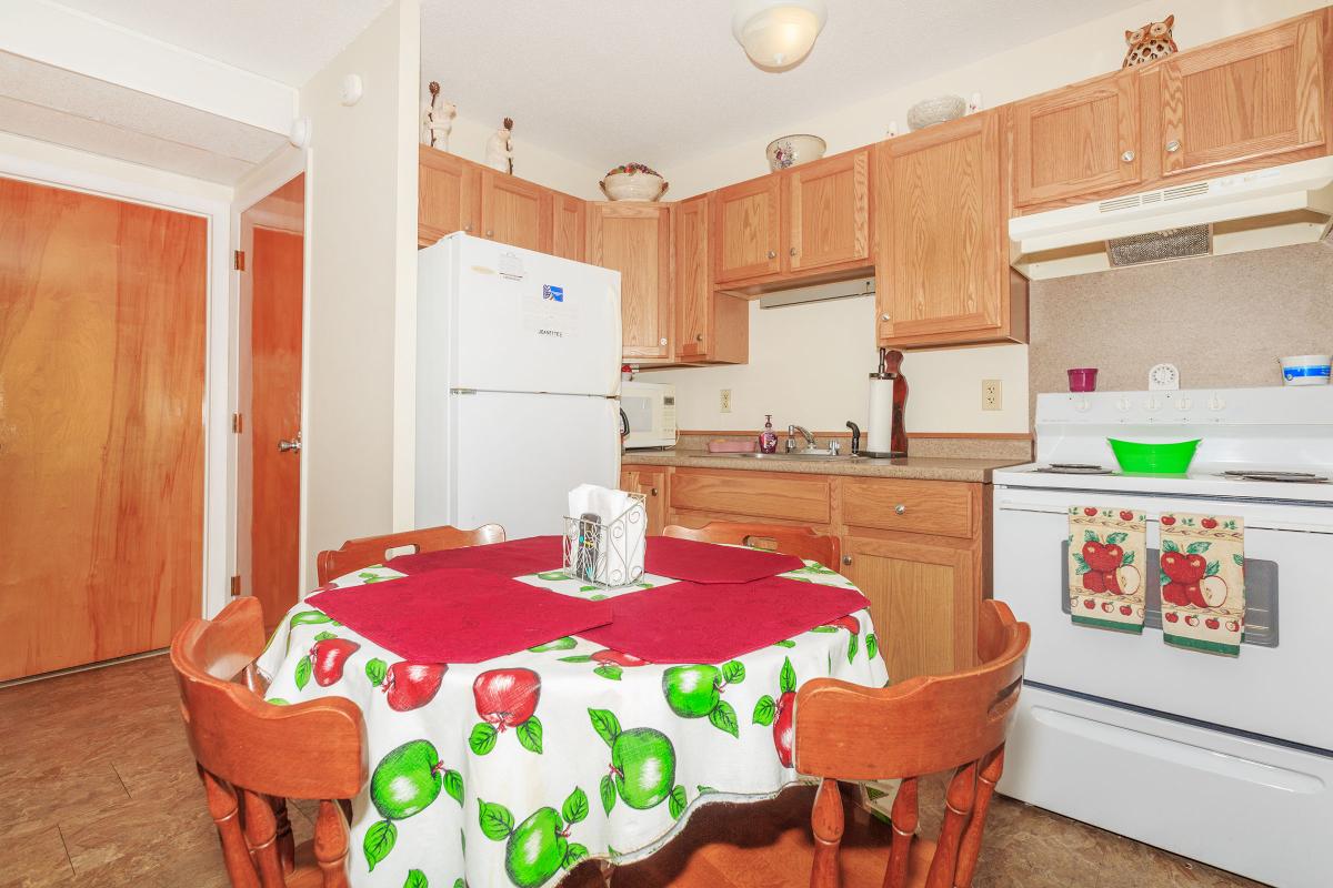 a kitchen with a table in a room