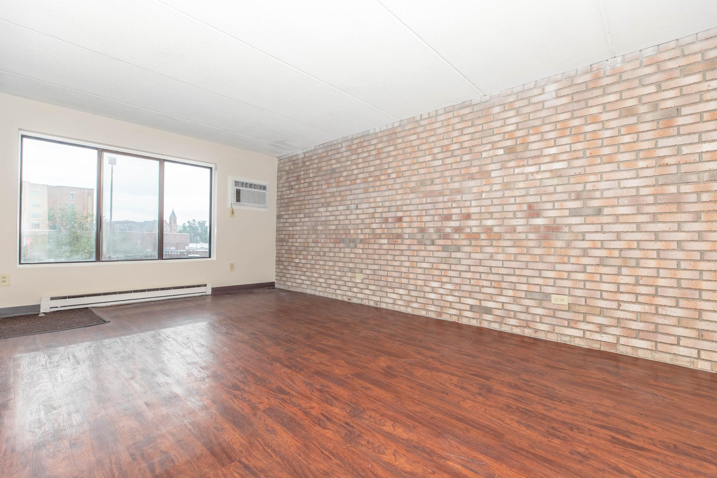 a large brick building with a wooden floor