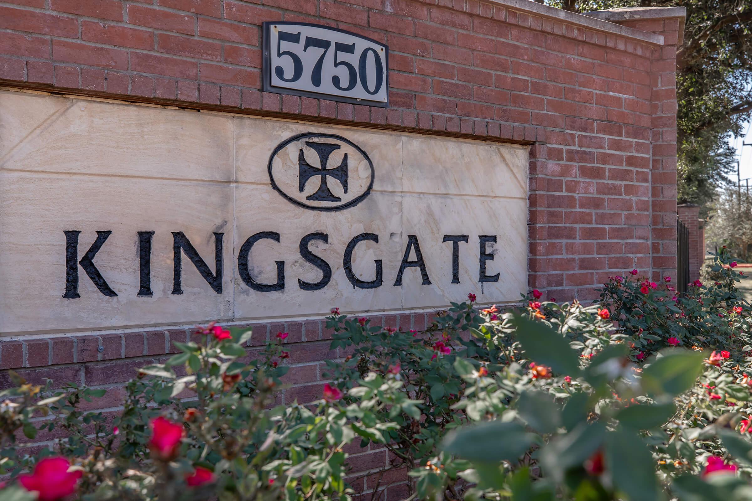 a sign in front of a brick building