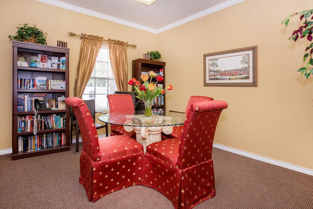 a large red chair in the living room