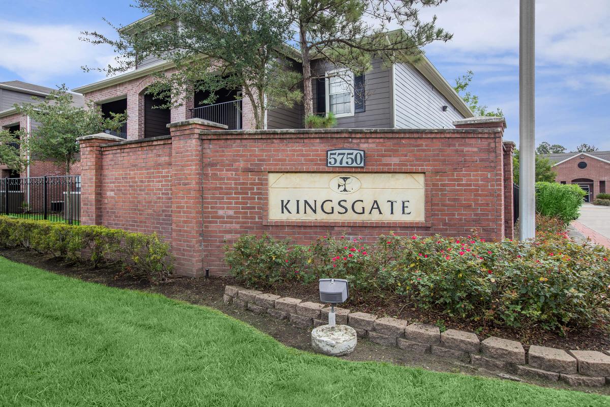 a sign in front of a brick building