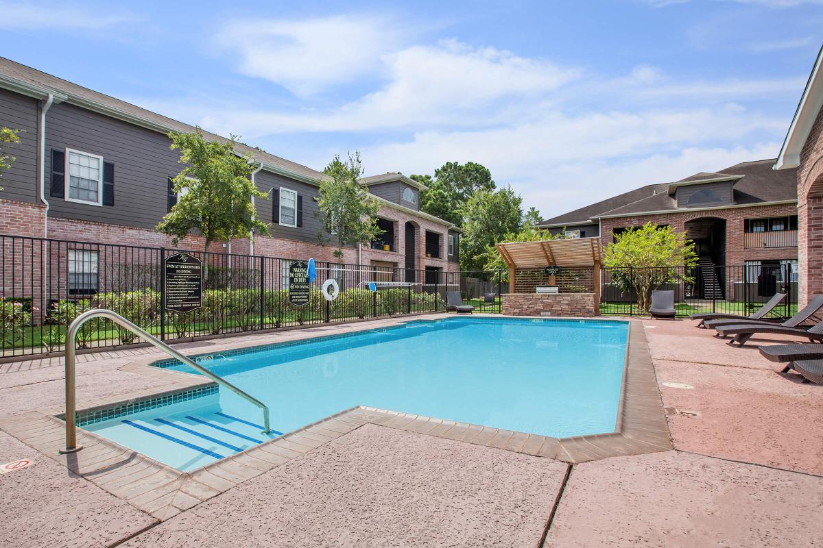 a pool next to a brick building