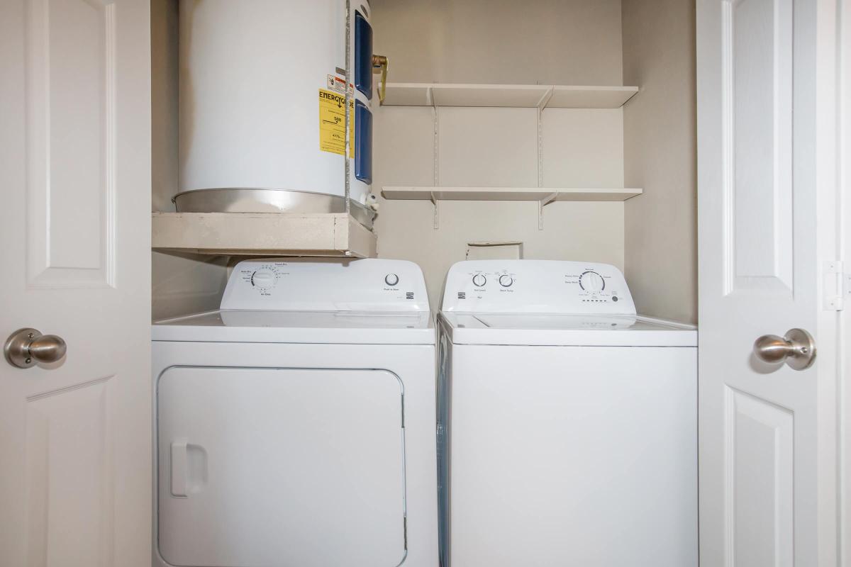 a white refrigerator freezer sitting next to a sink