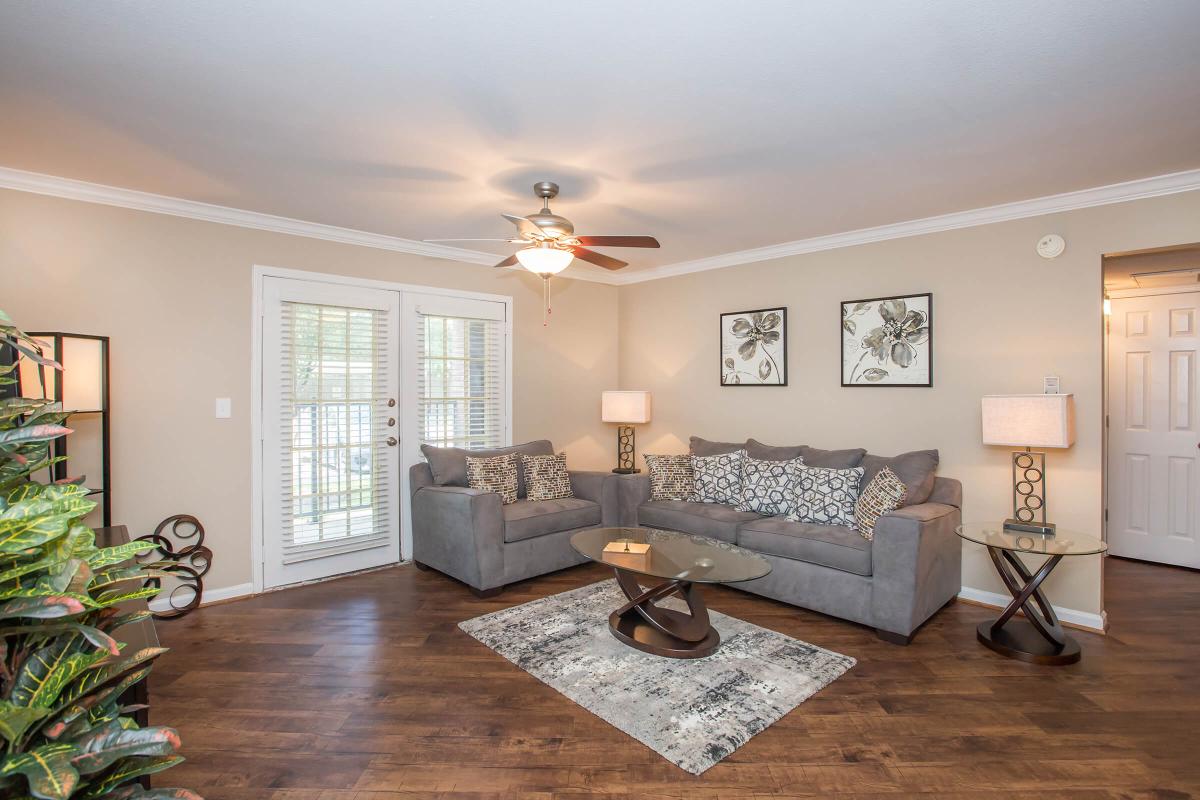 a living room filled with furniture and a fire place