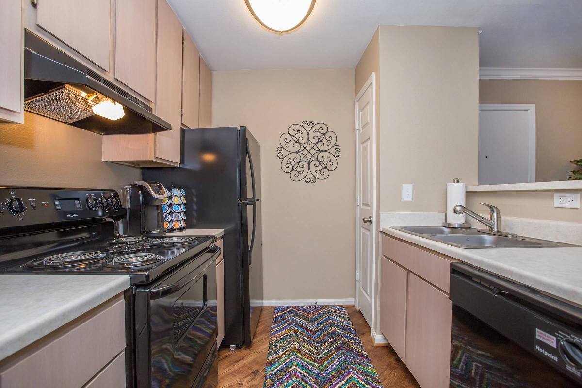 a kitchen with a stove and a sink