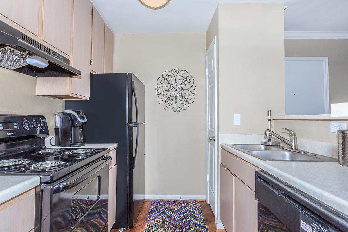 a kitchen with a stove top oven