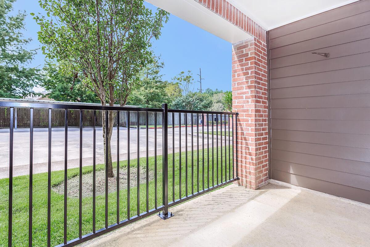 a gate in front of a fence