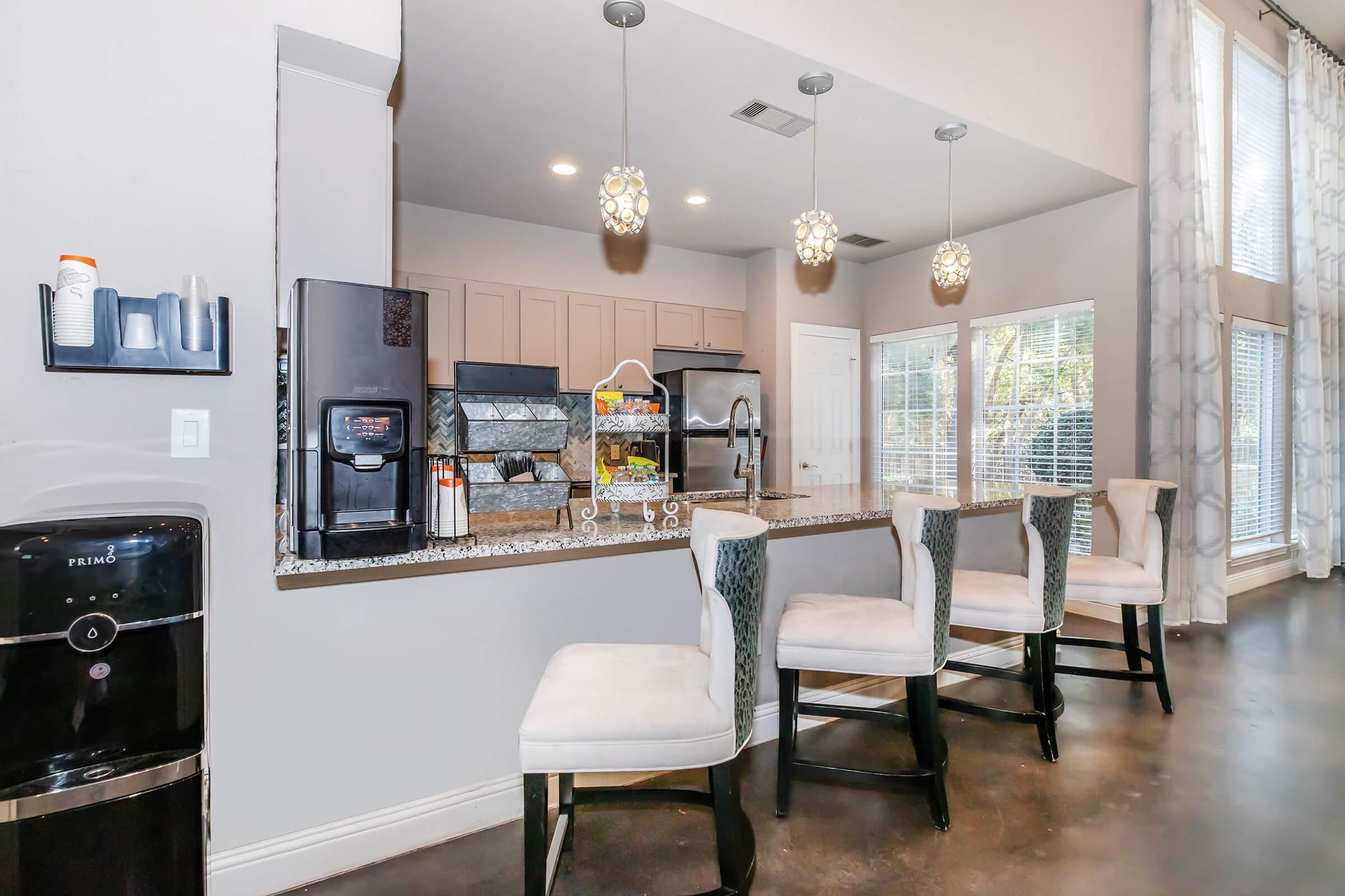 a kitchen with a table in a room