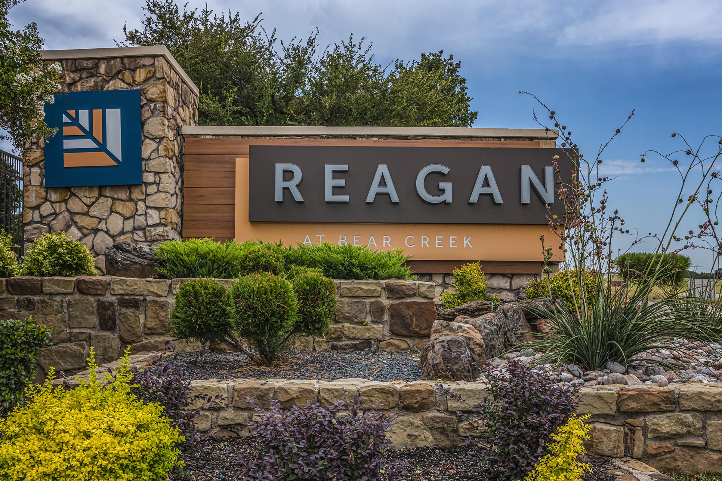 a sign in front of a house