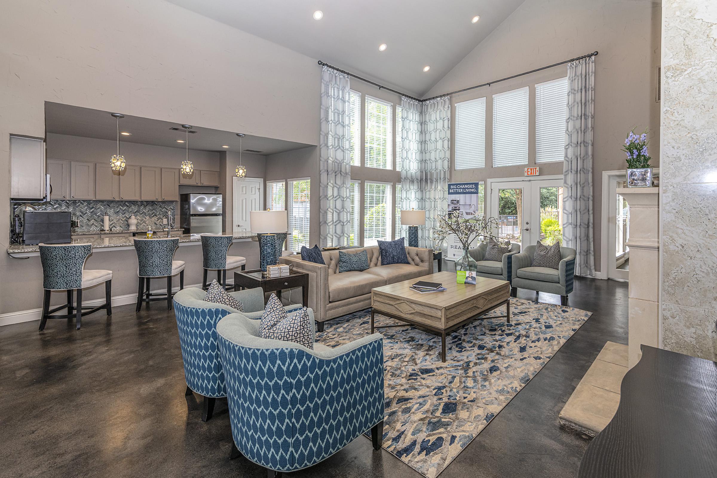 a living room filled with furniture and vase