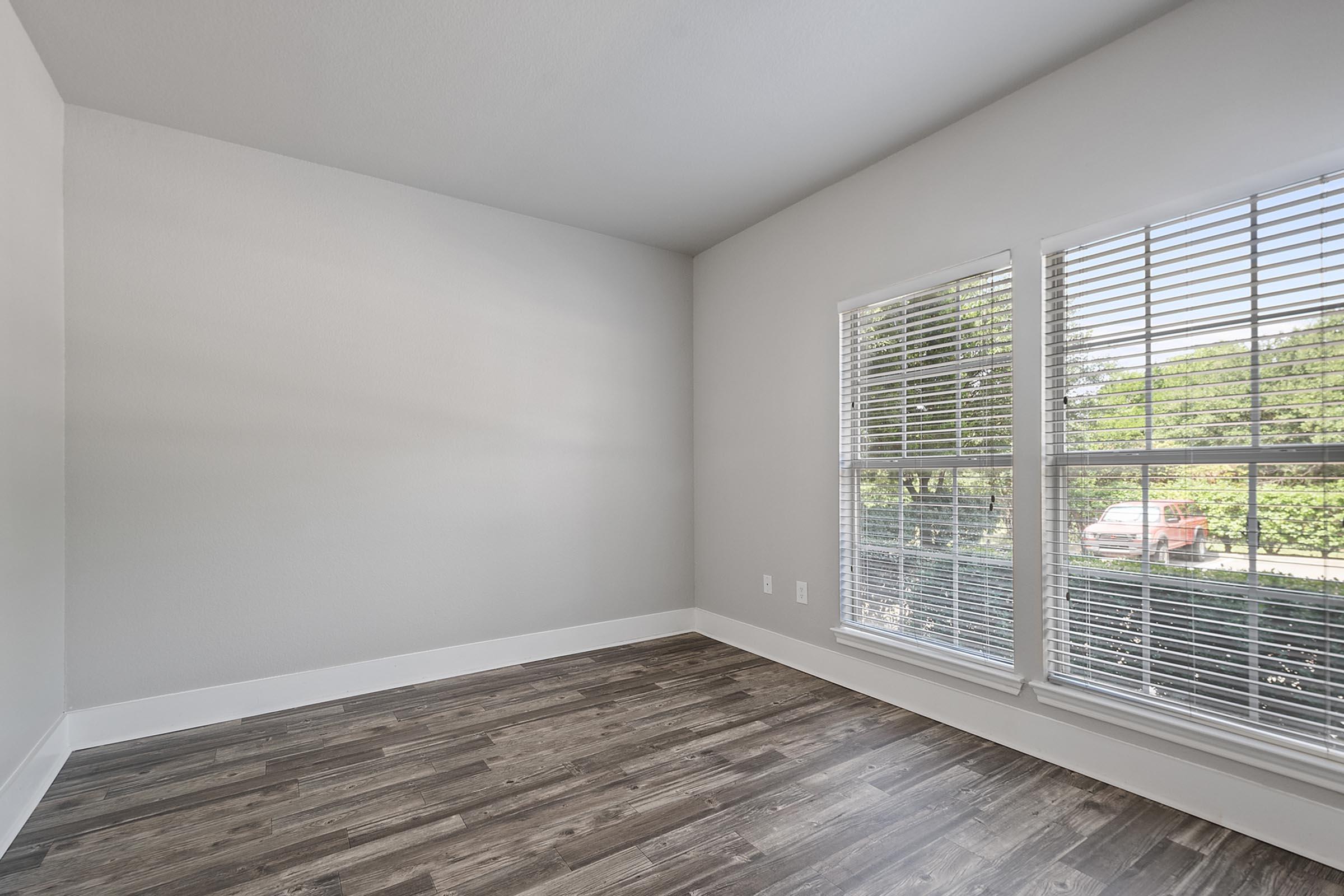 a bedroom with a large window