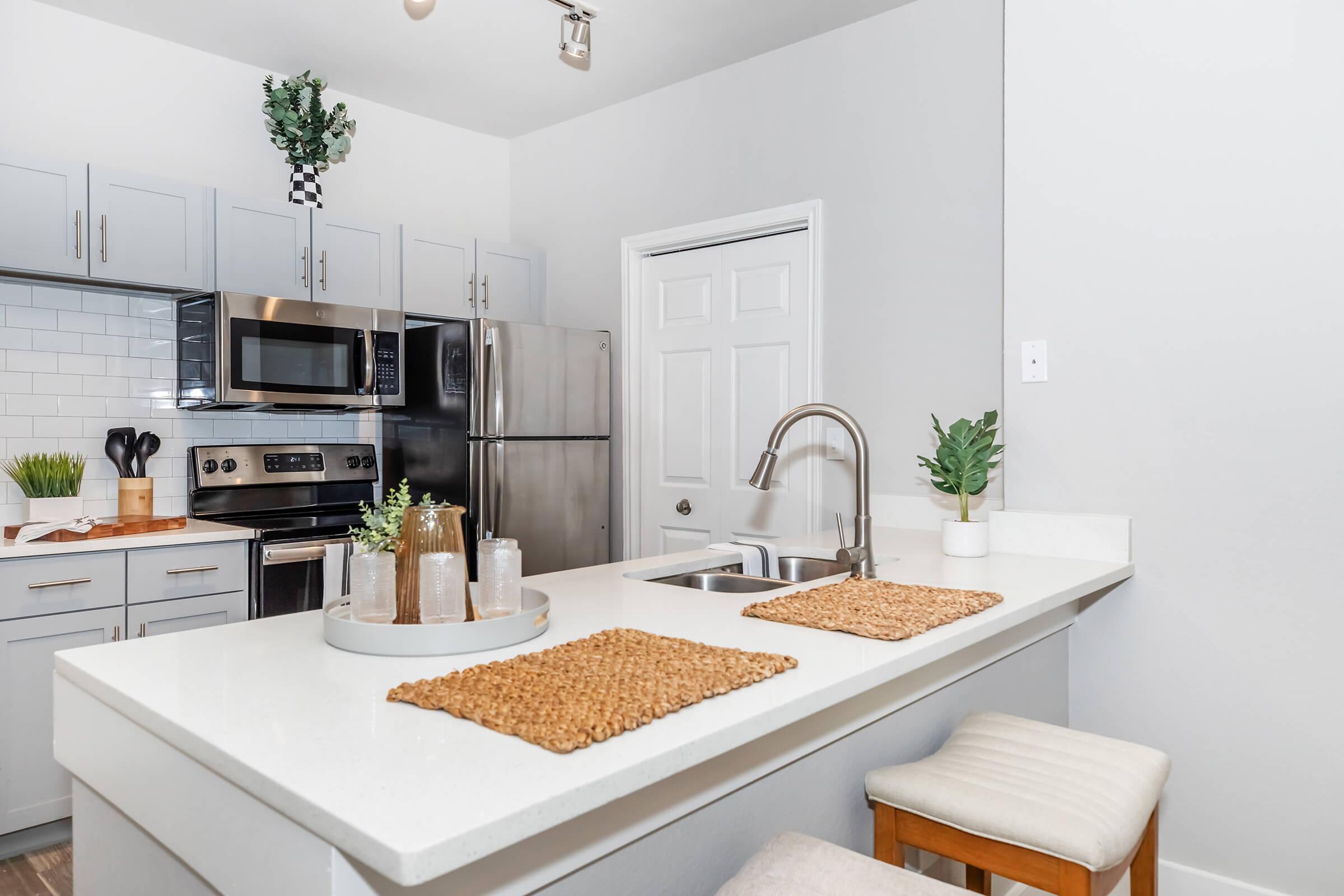 a kitchen with a sink and a counter