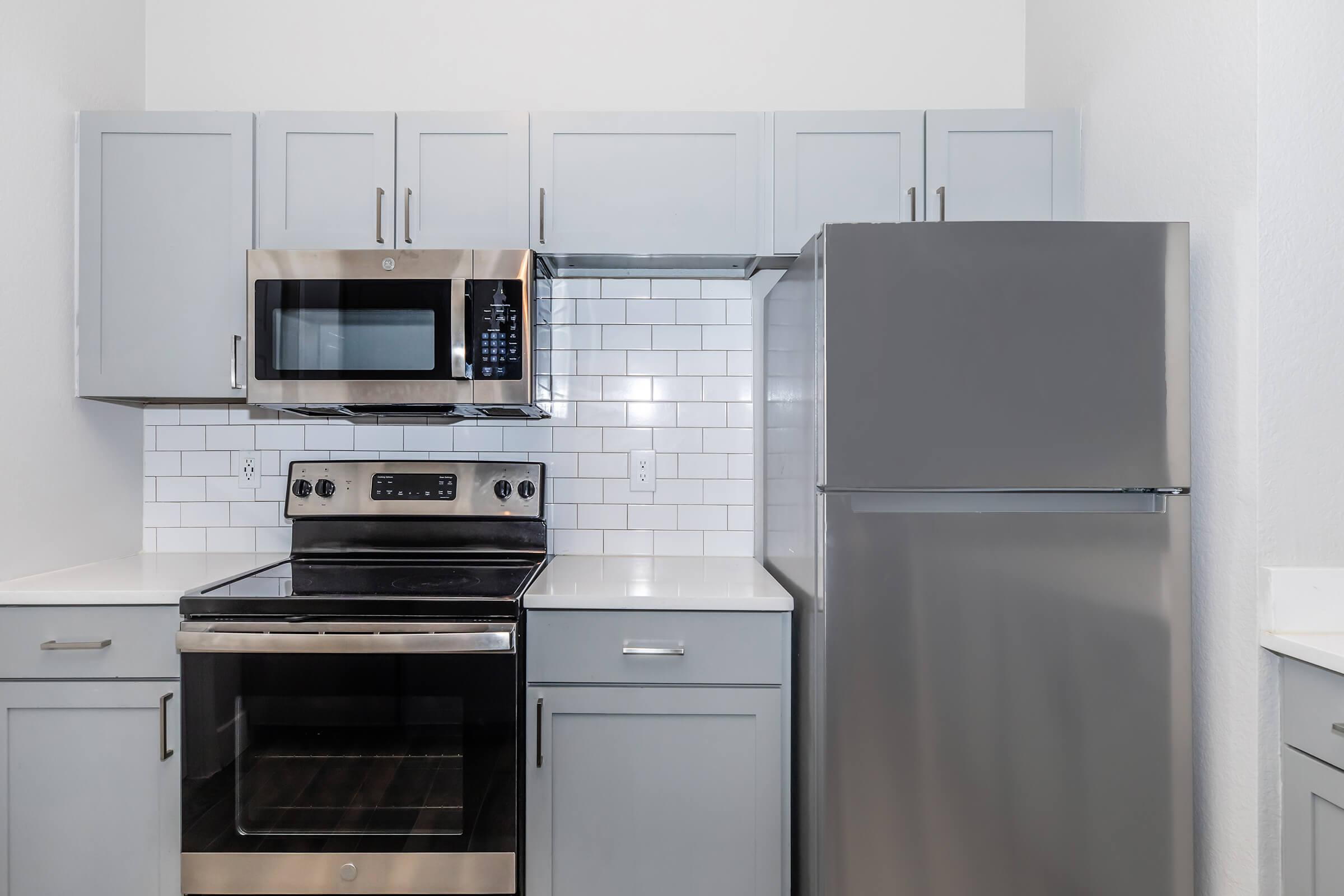 a kitchen with a stove top oven sitting inside of a refrigerator