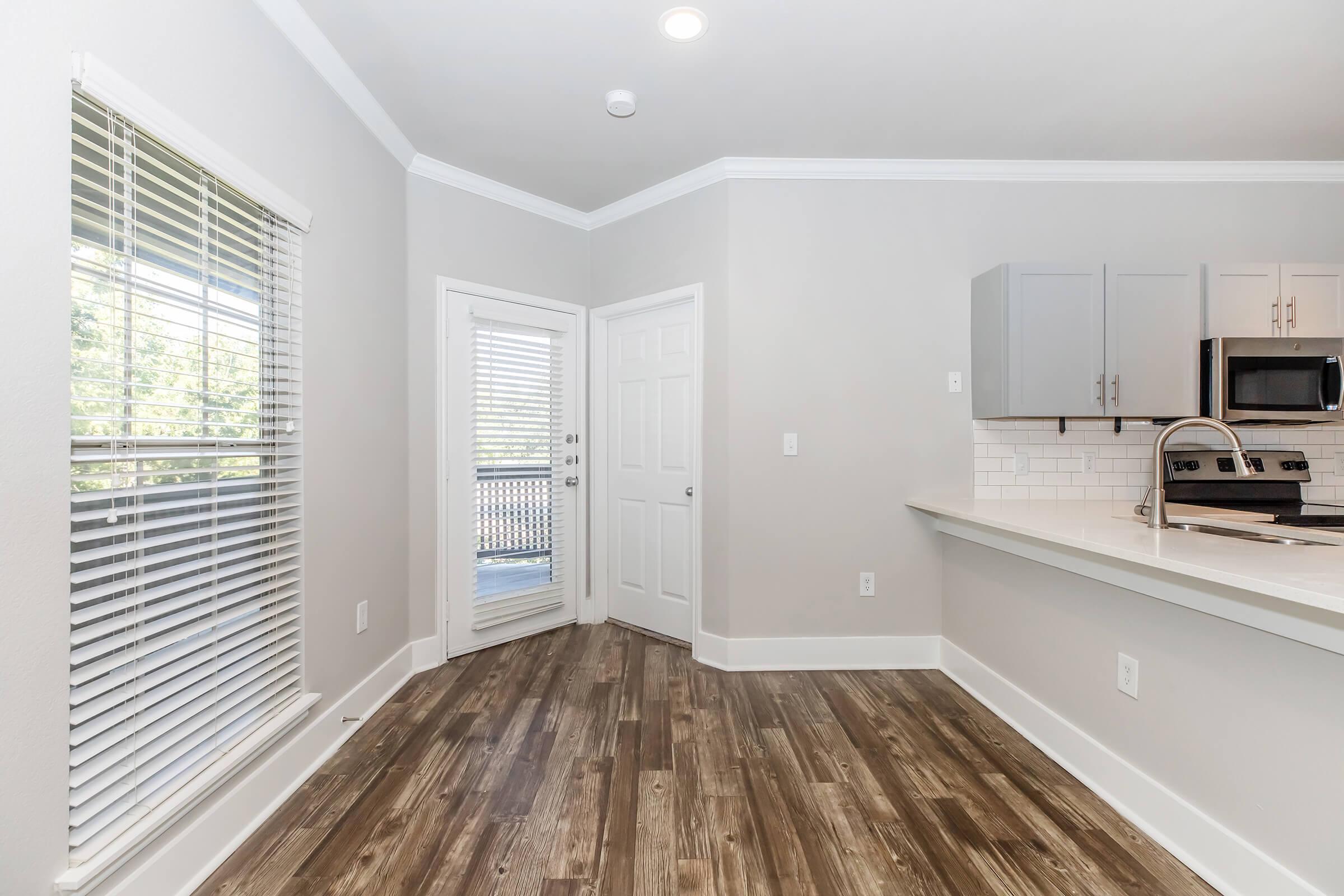 a kitchen with a large window