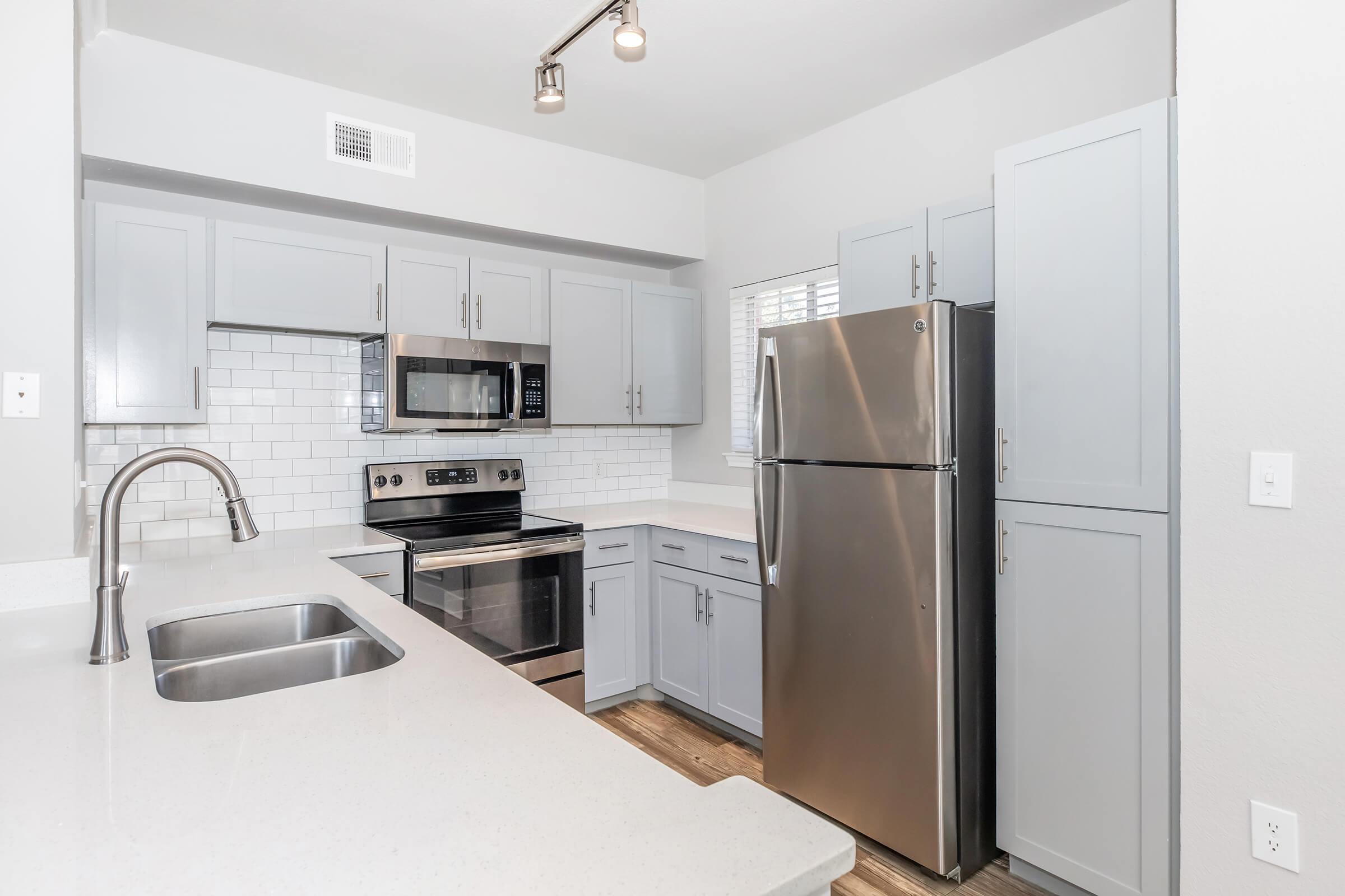 a stainless steel refrigerator in a kitchen