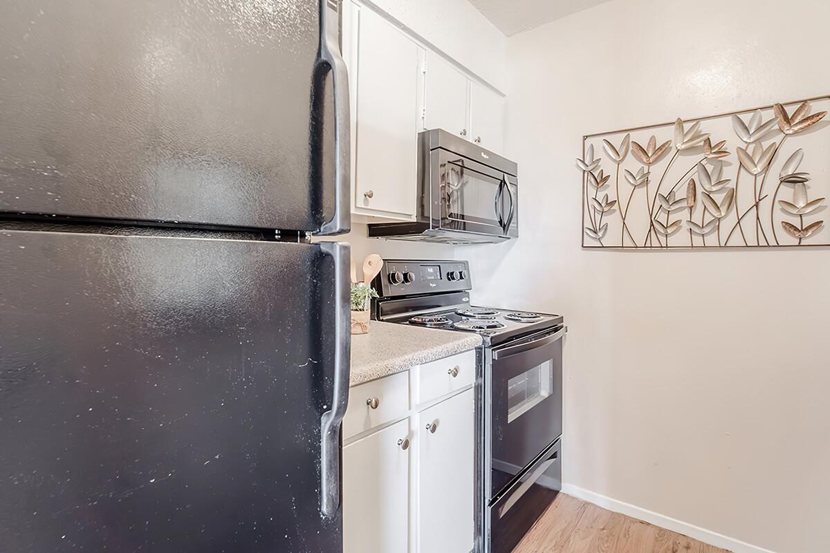 a kitchen with a stove top oven sitting inside of a refrigerator