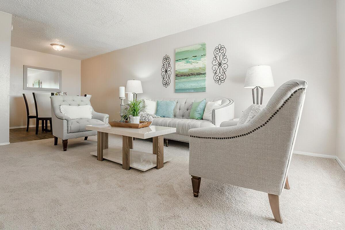 a bedroom with a bed and desk in a room