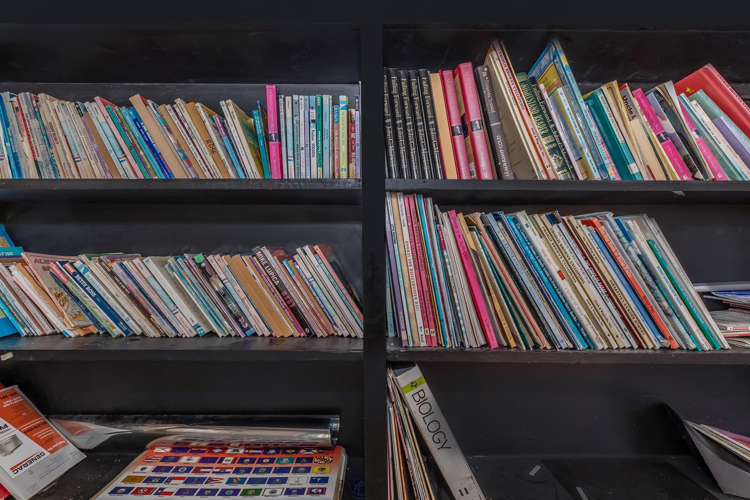 a close up of a book shelf filled with books