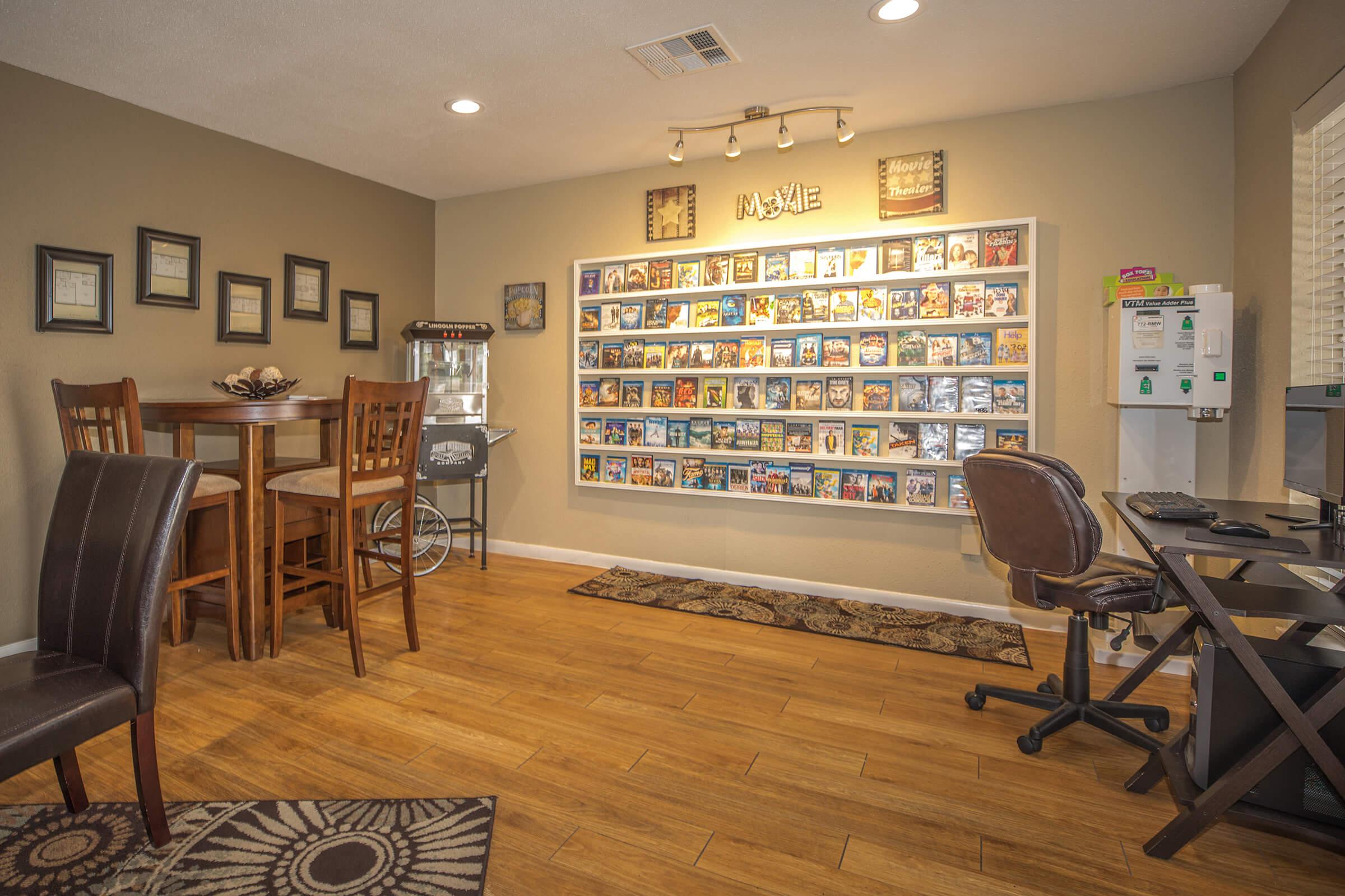 a living room filled with furniture and a tv