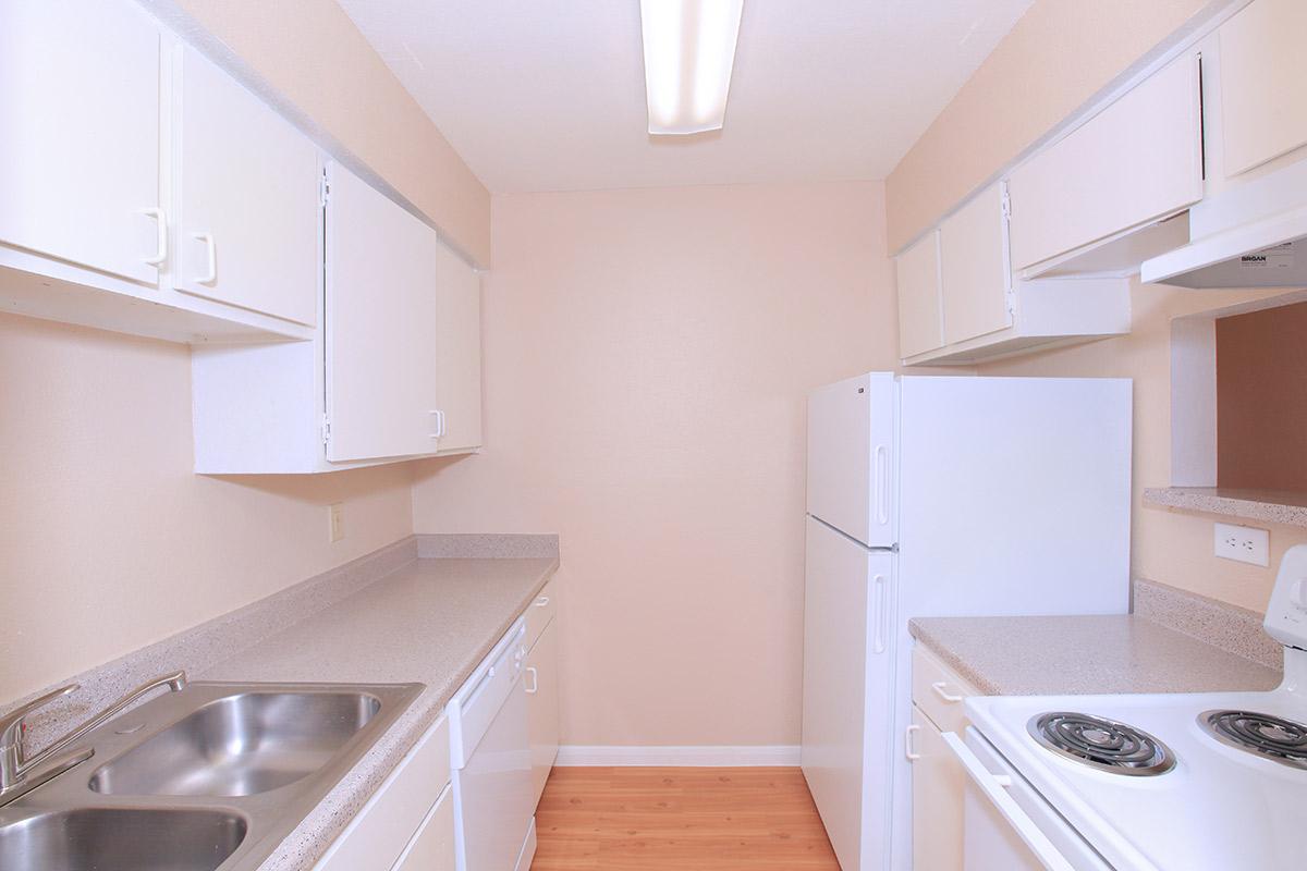 a kitchen with a stove top oven