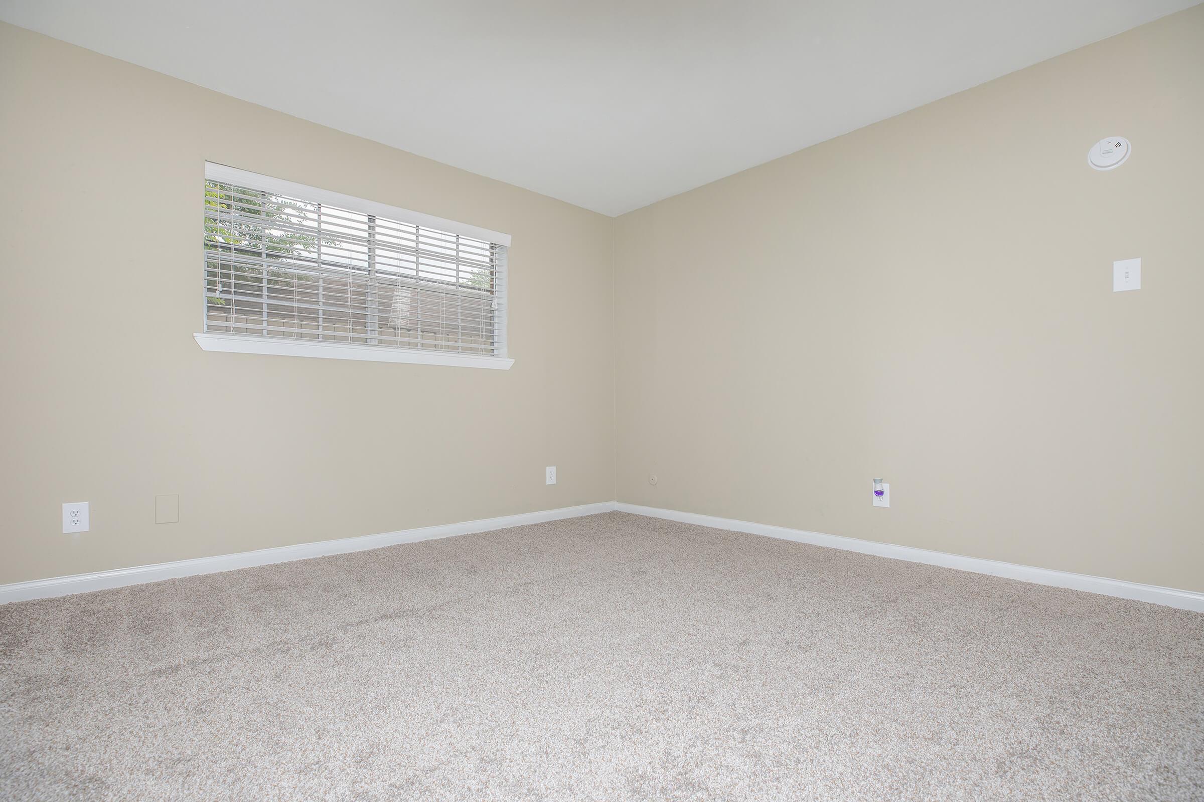 a bedroom with a large window