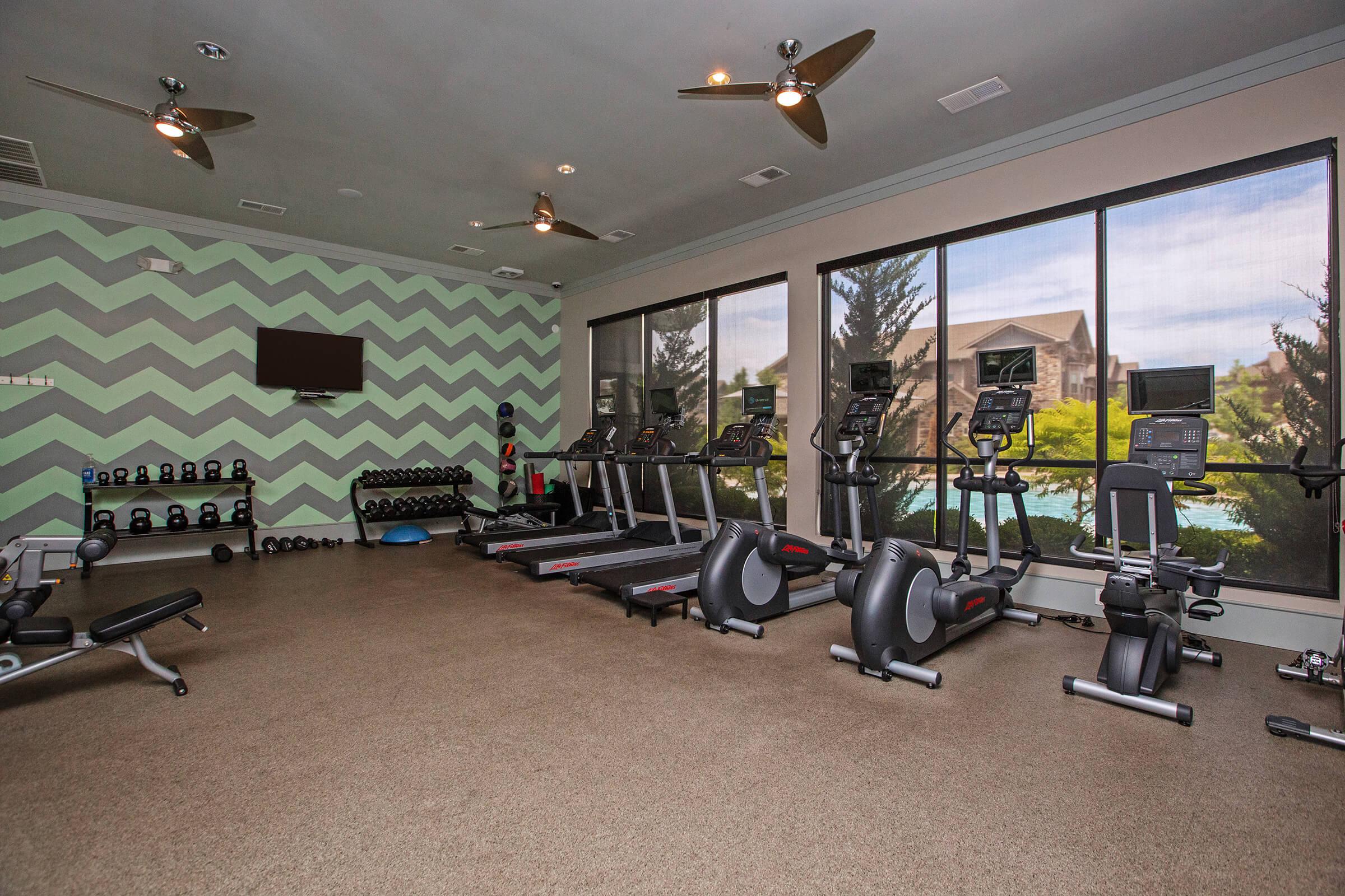 a living room filled with furniture and a tv