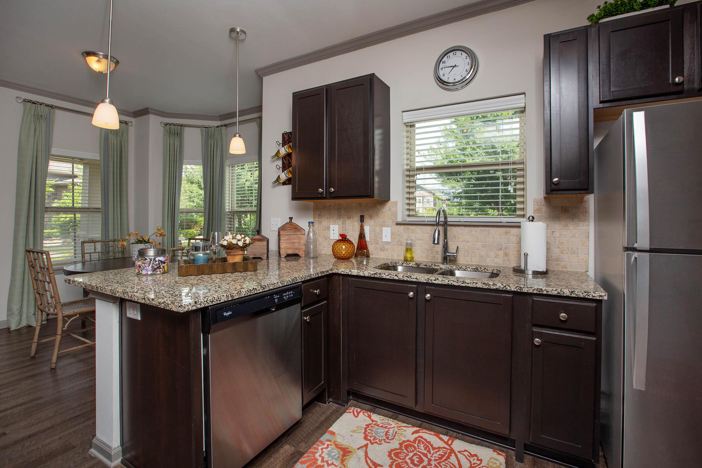 a large kitchen with stainless steel appliances