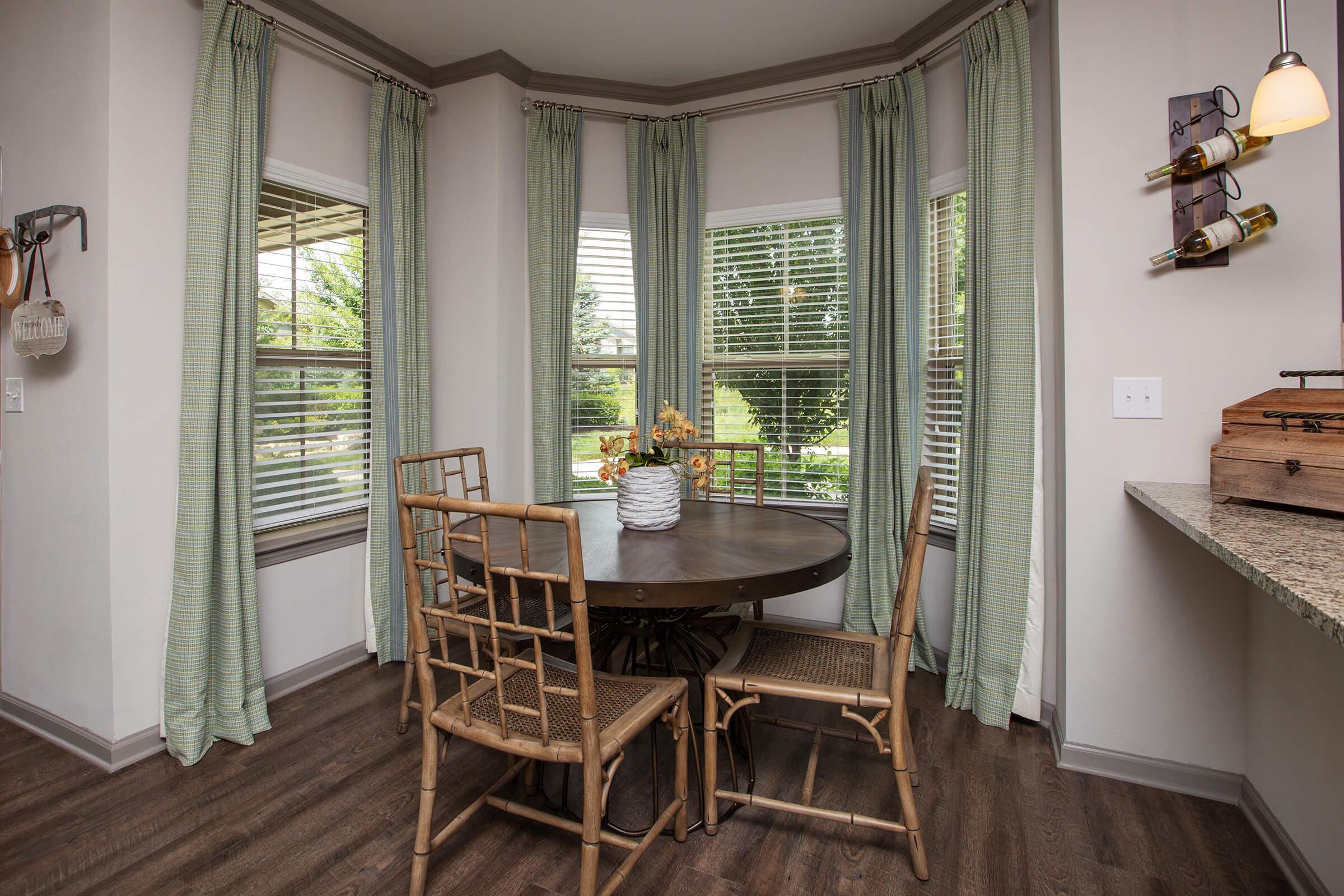 a room filled with furniture and a large window