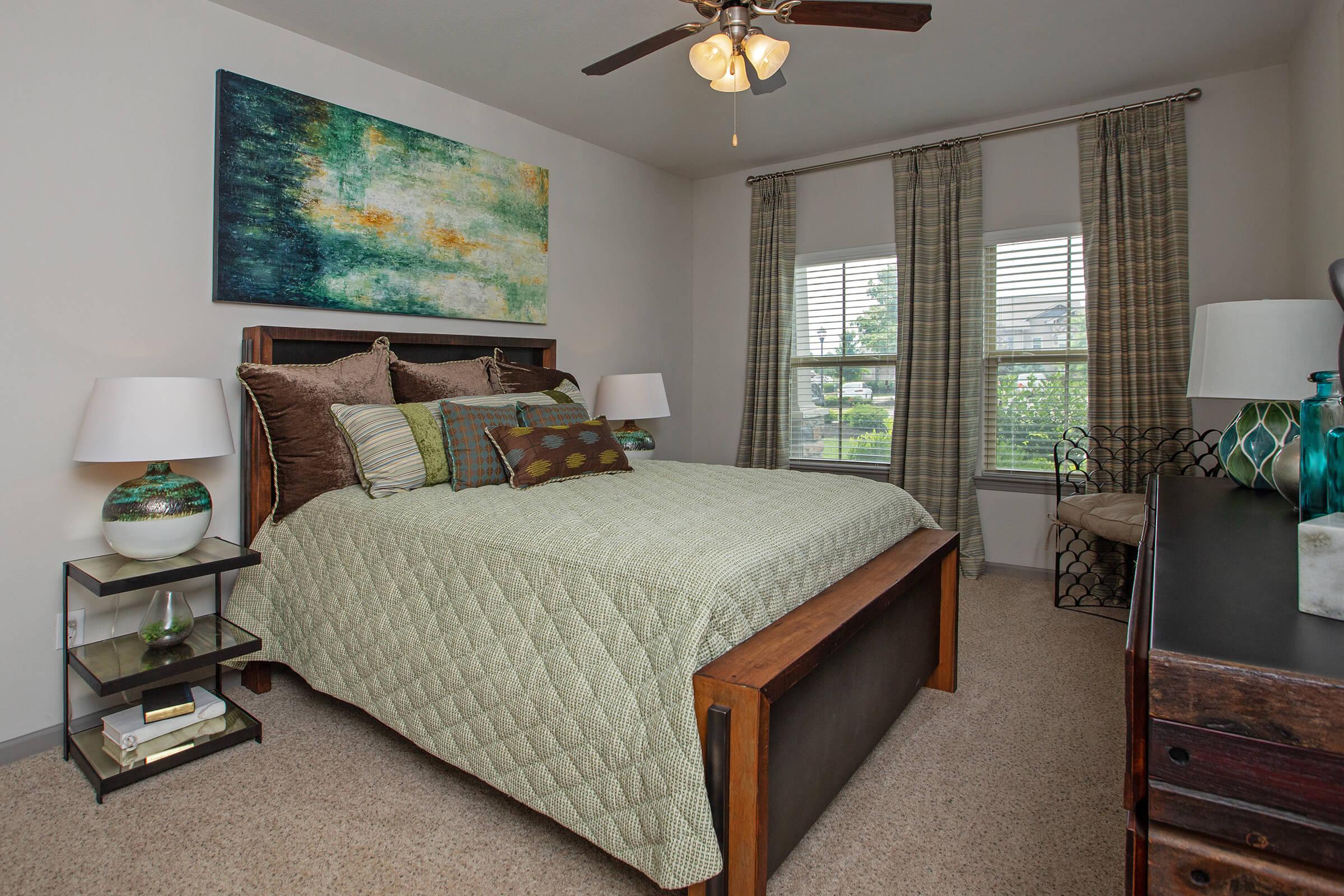 a bedroom with a bed and a couch in a living room