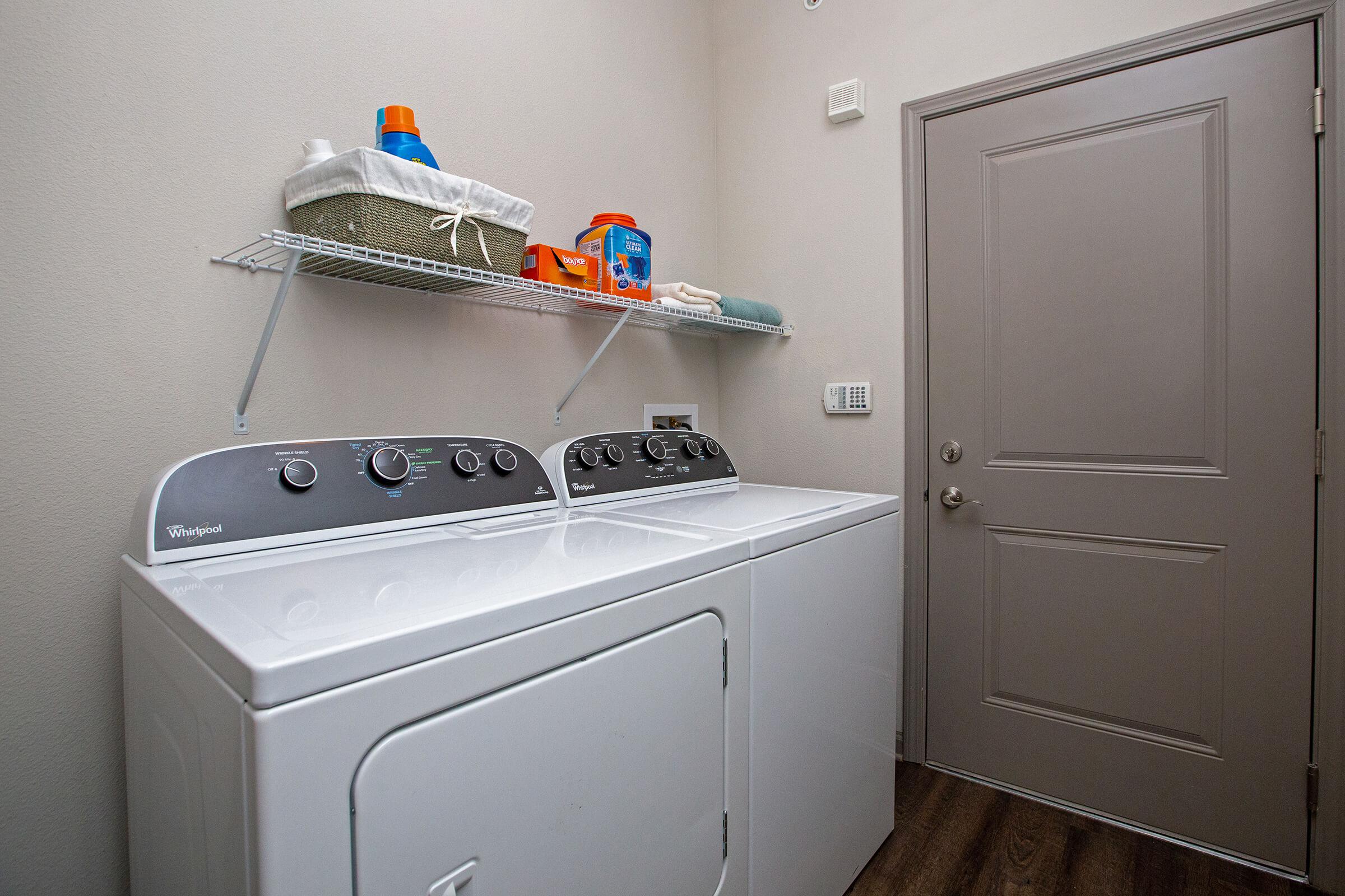 a white refrigerator freezer sitting inside of a kitchen