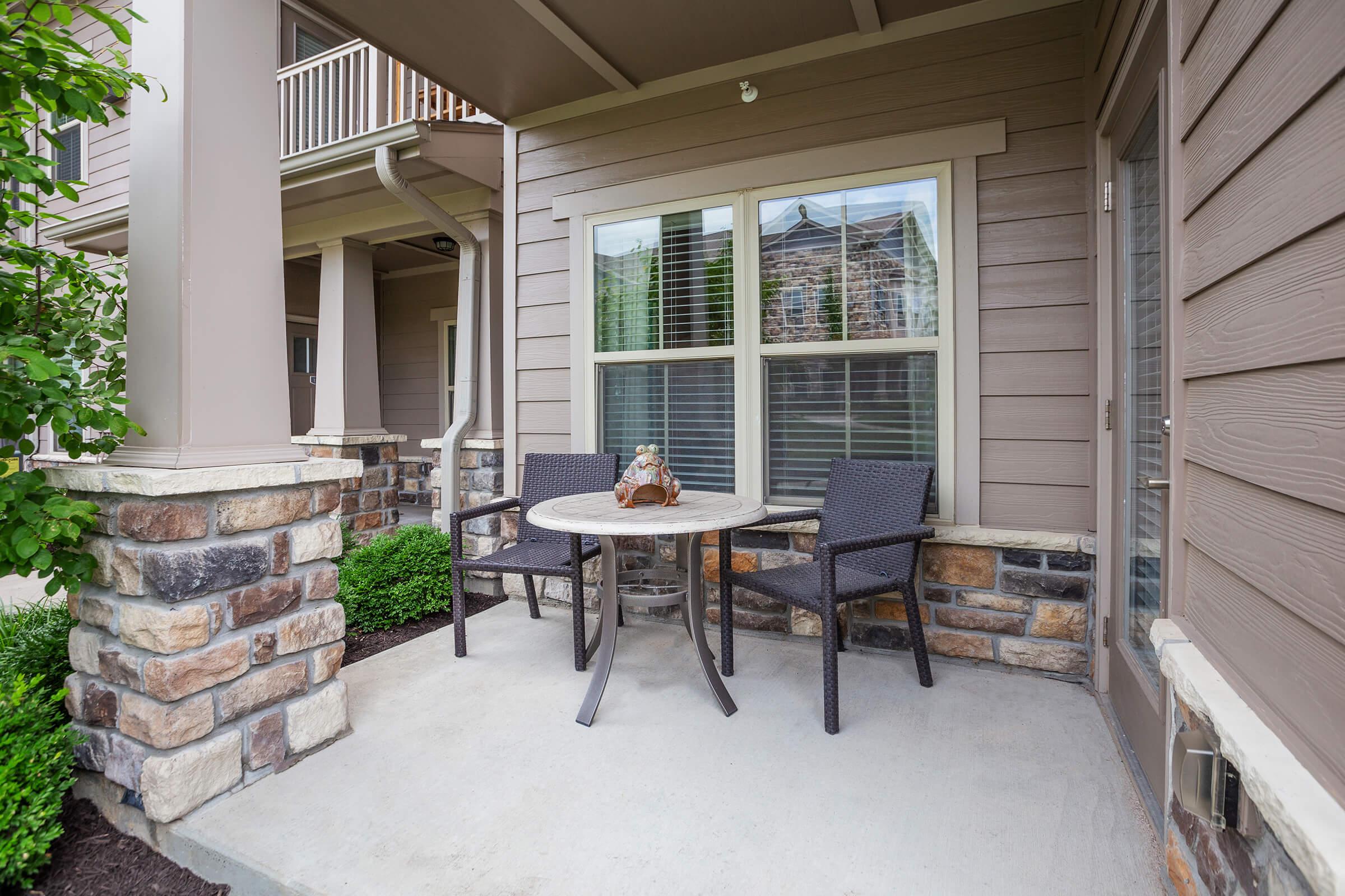 a chair sitting in front of a house