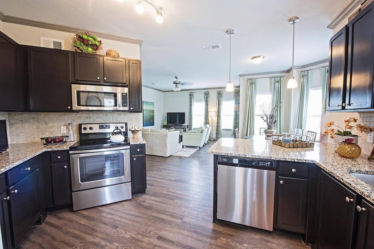 a large kitchen with stainless steel appliances