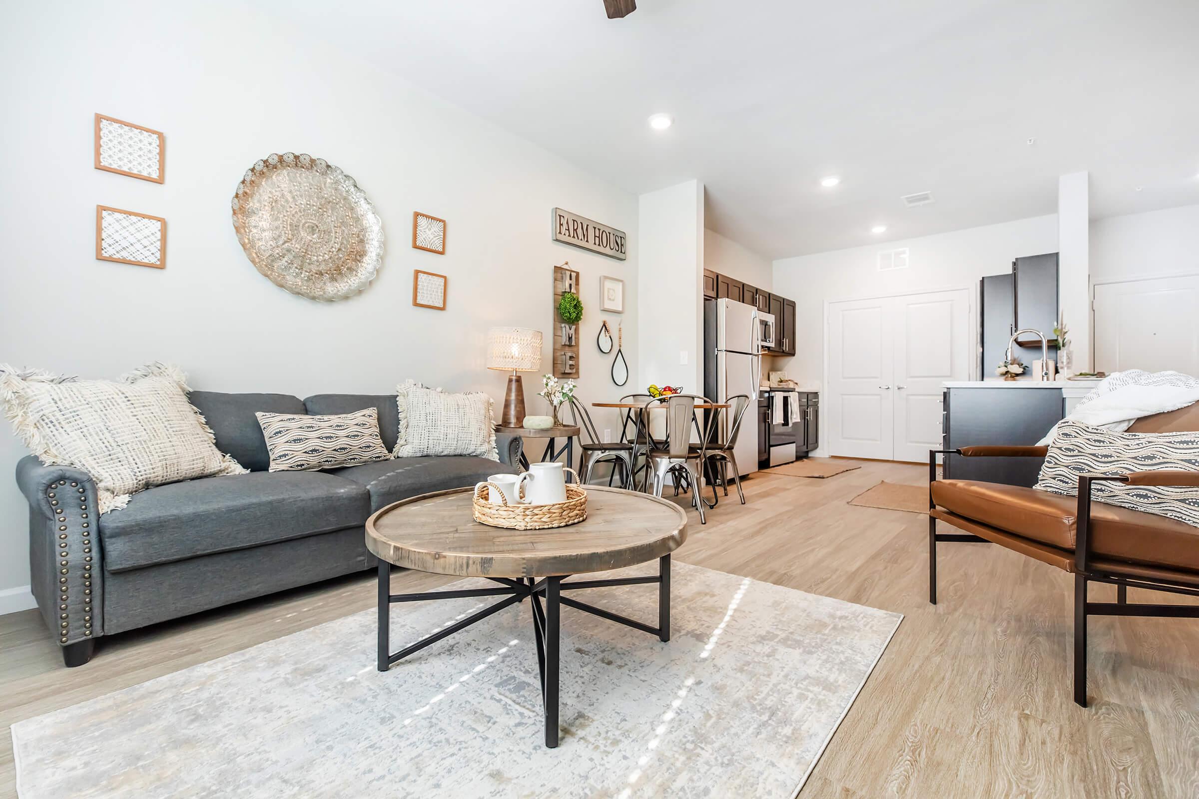 a living room filled with furniture and a table