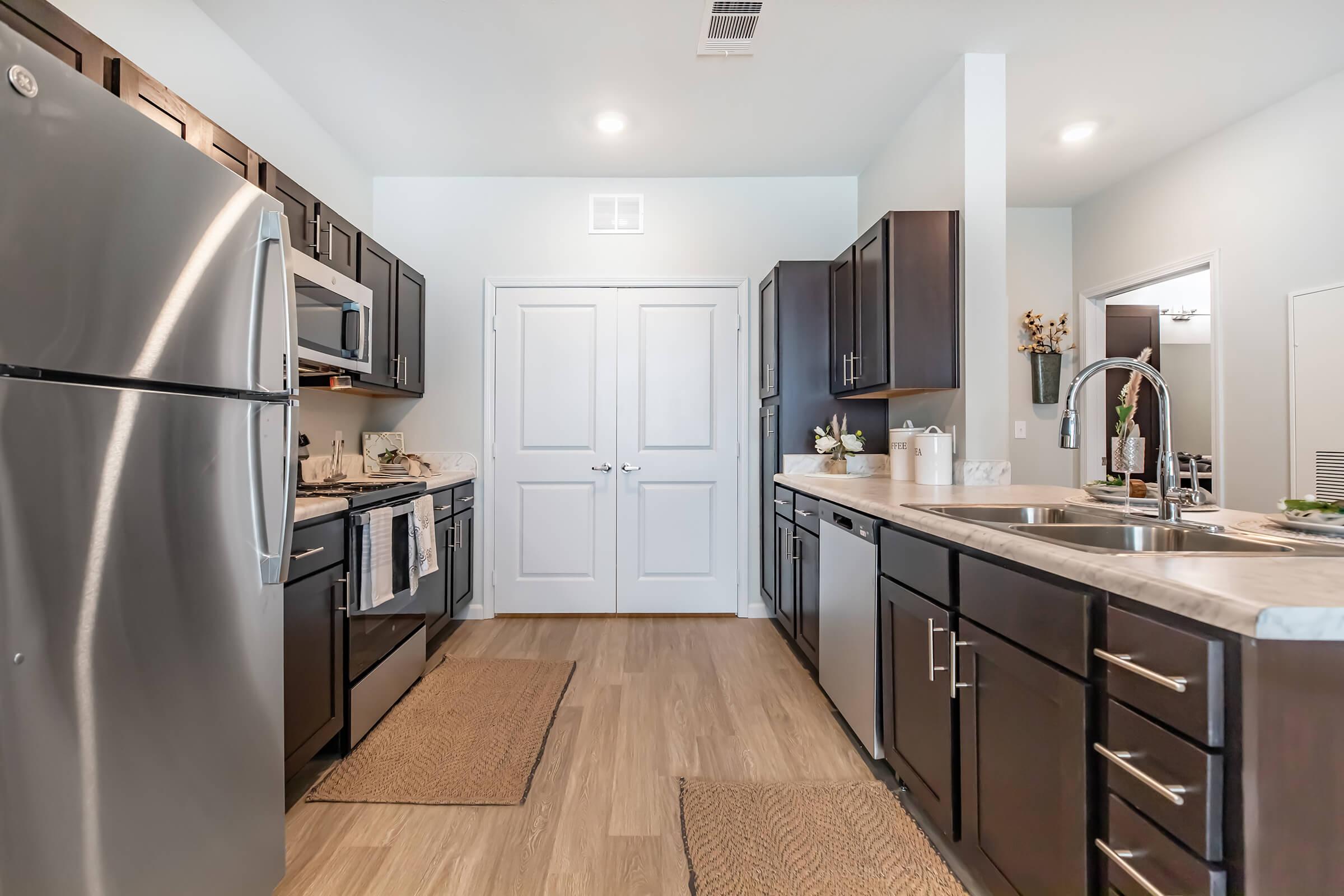 a large kitchen with stainless steel appliances