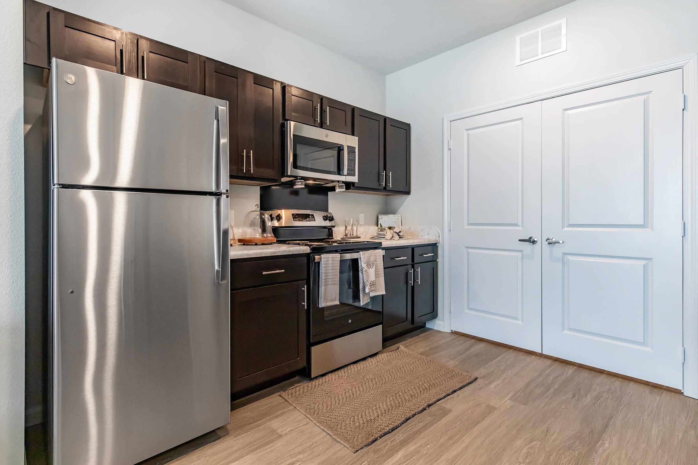 a stainless steel refrigerator in a kitchen