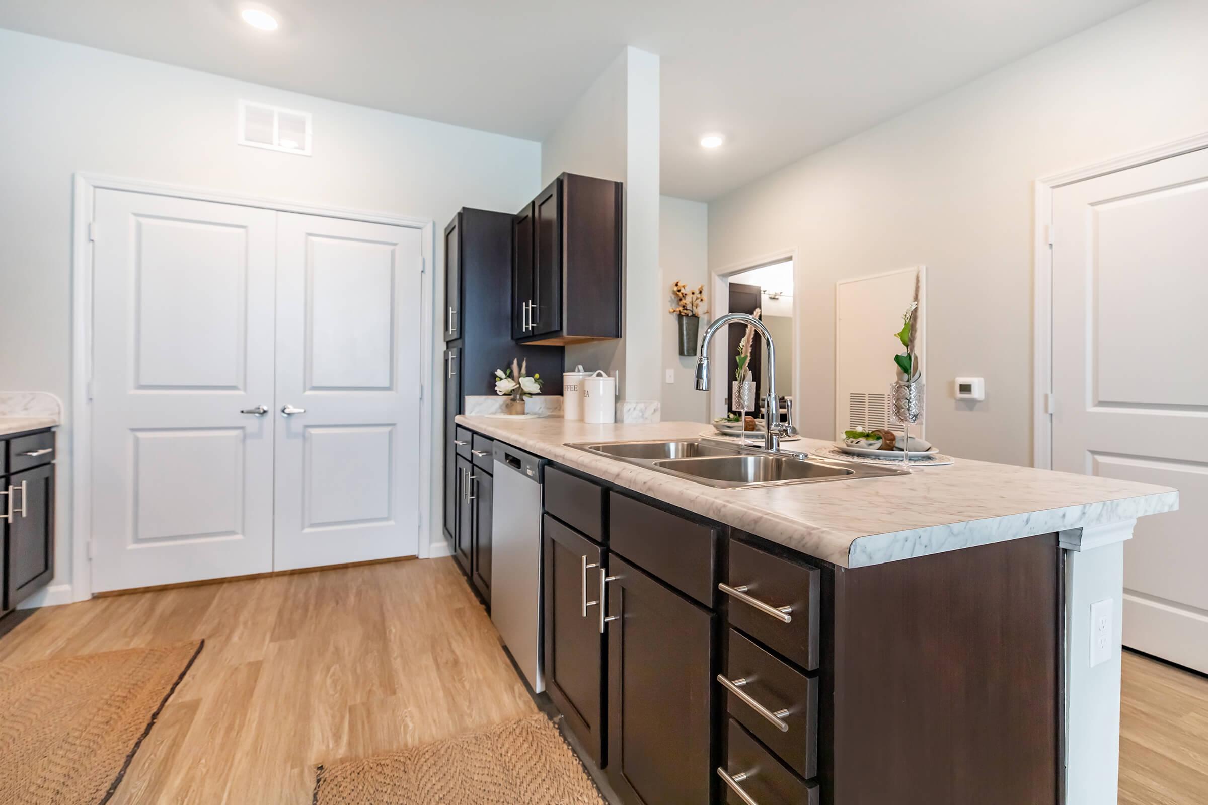 a kitchen with stainless steel appliances and wooden cabinets