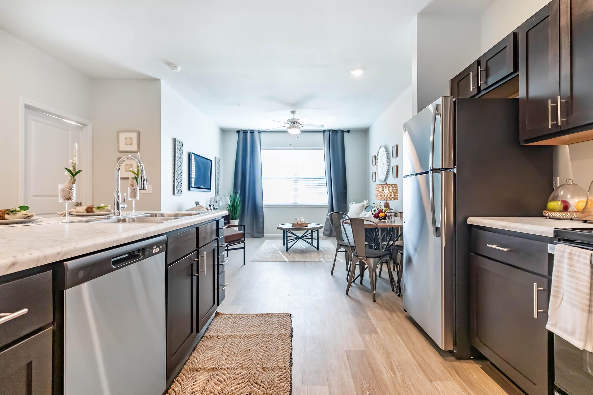 a kitchen with an island in the middle of a room