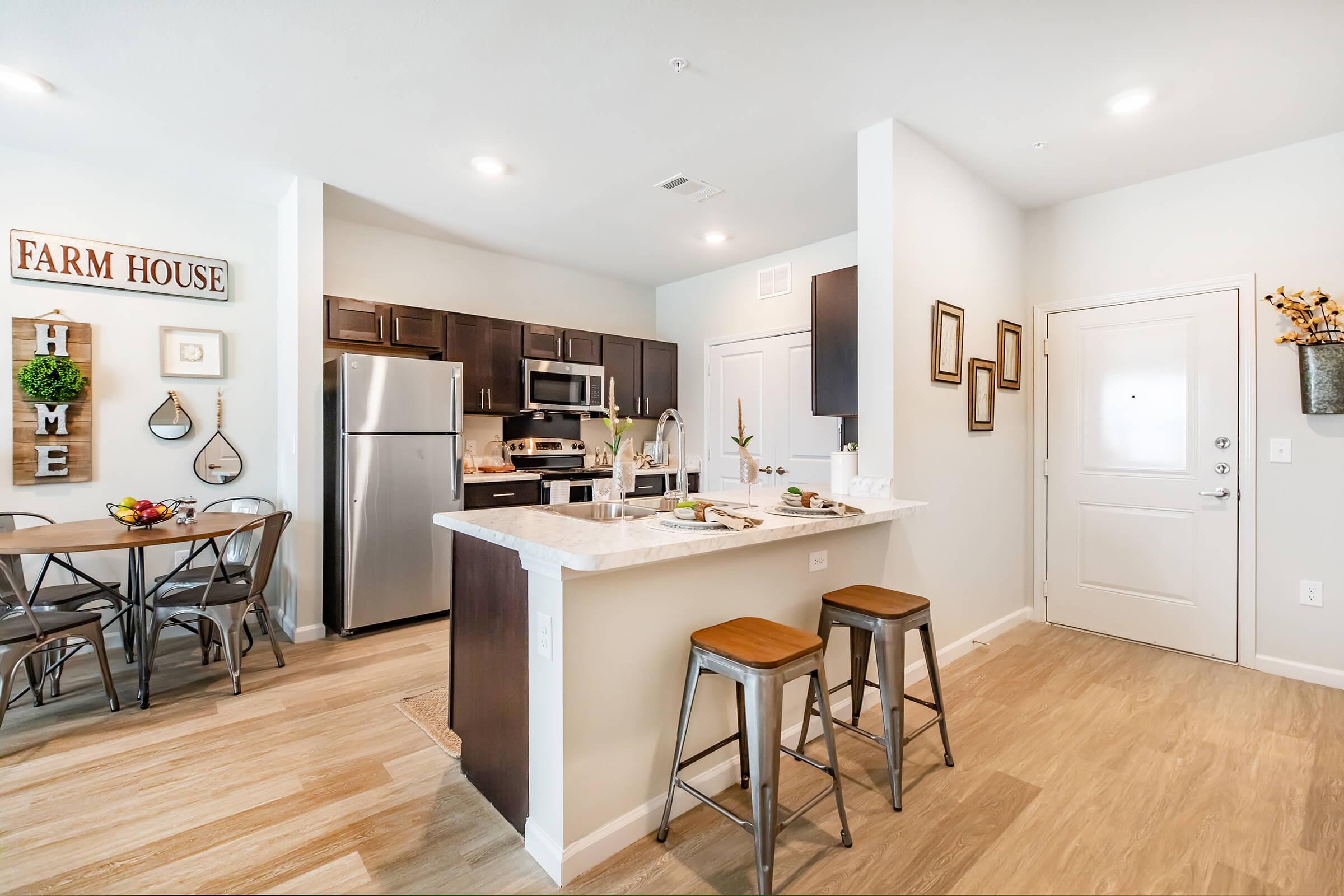 a kitchen with a dining room table