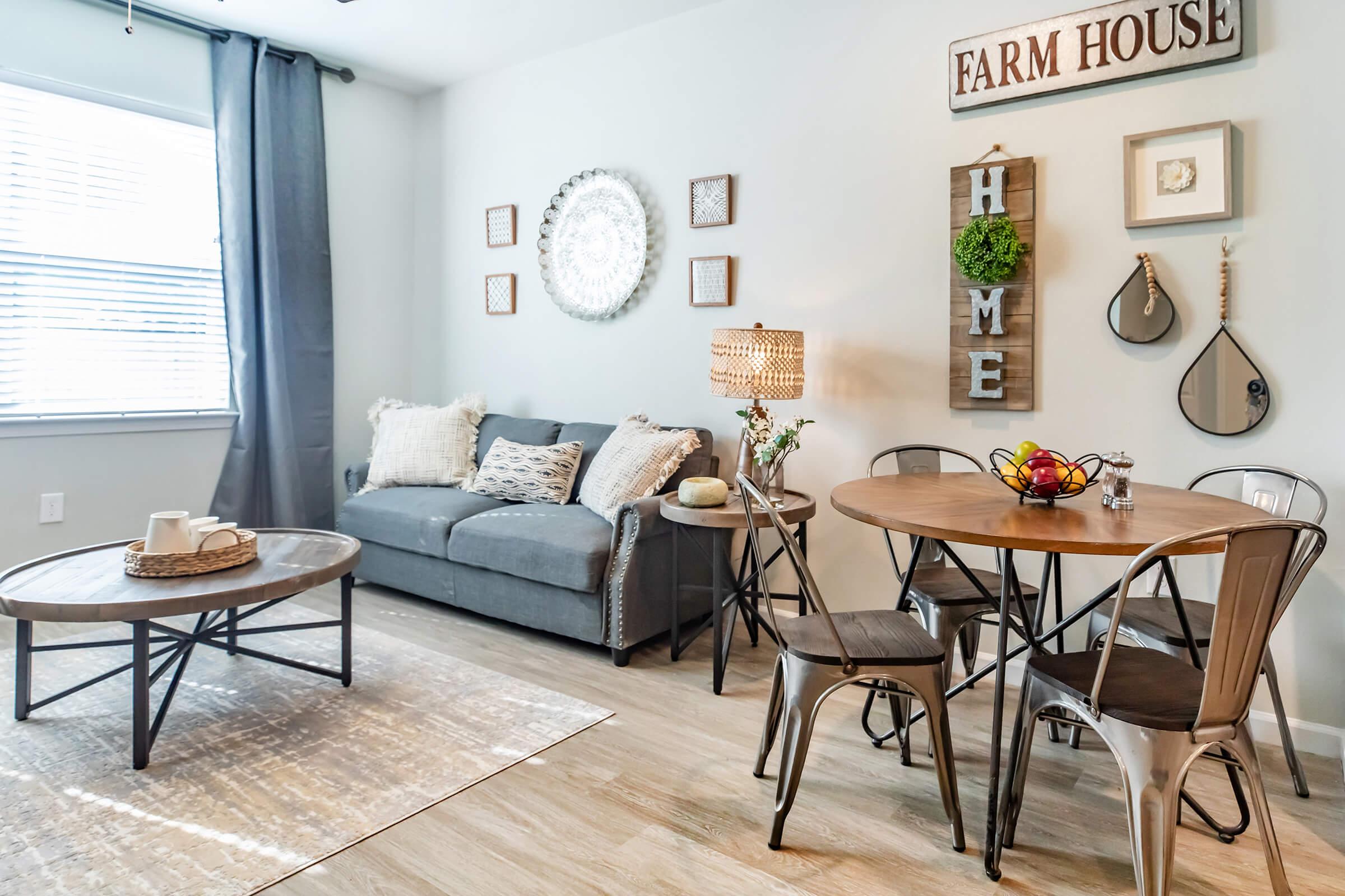 a living room filled with furniture and a fireplace