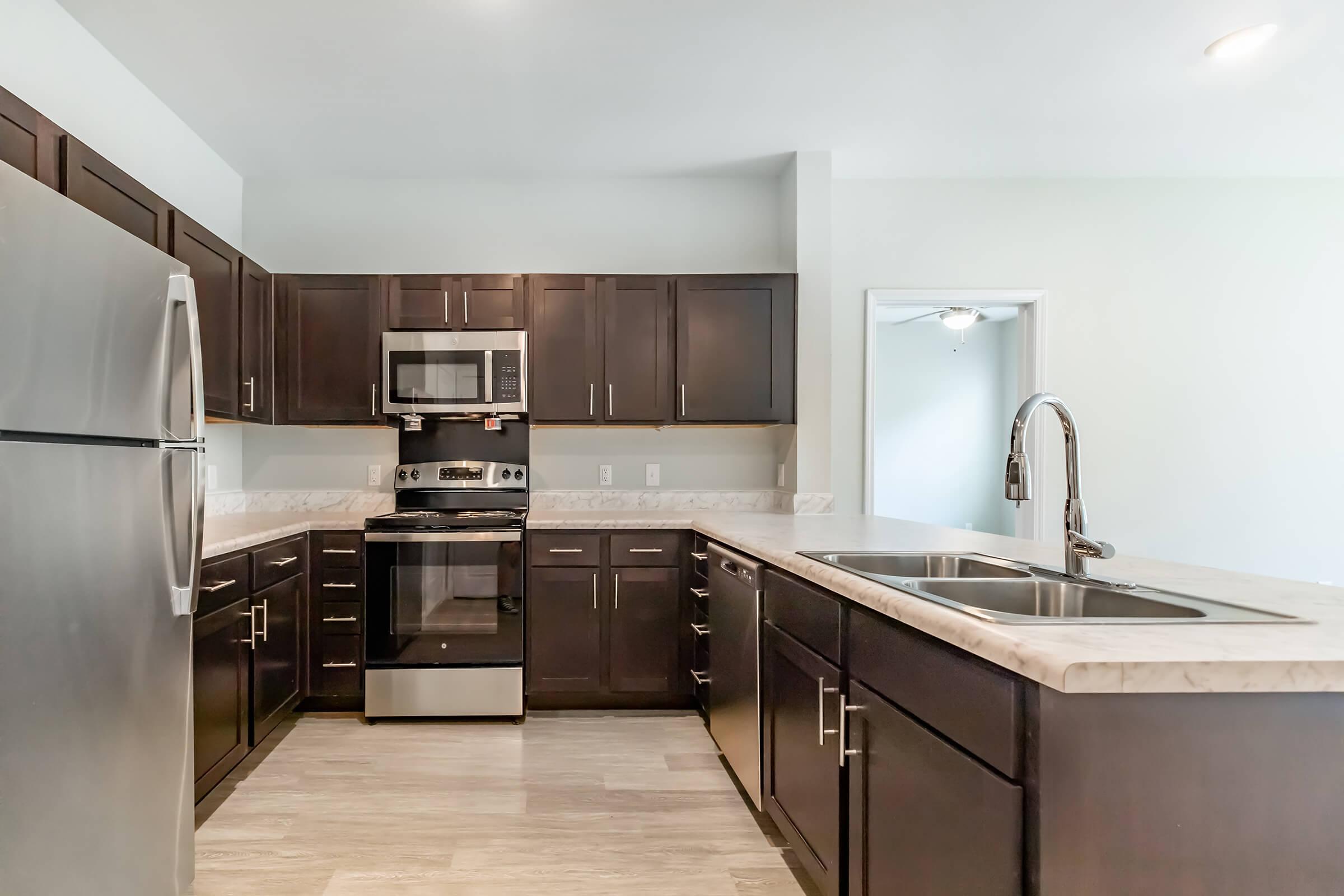 a large kitchen with stainless steel appliances