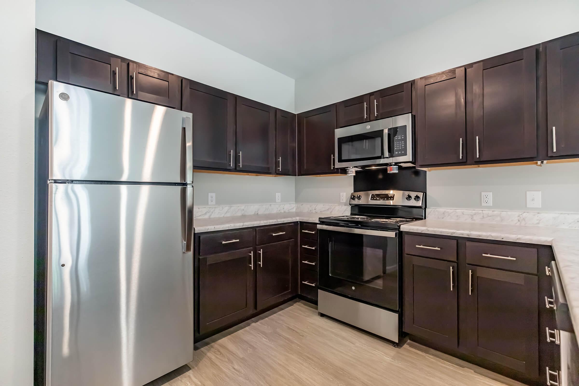 a stainless steel refrigerator in a kitchen